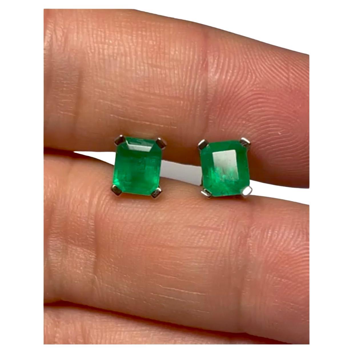 Natural AAA Colombian emeralds emerald cut gemstone stud earrings prong set. These 18k gold stud earrings are hand-made by our expert jeweler and sparkle with a total weight of 2.09 Carats The emeralds have AAA+ intense green color(best color).