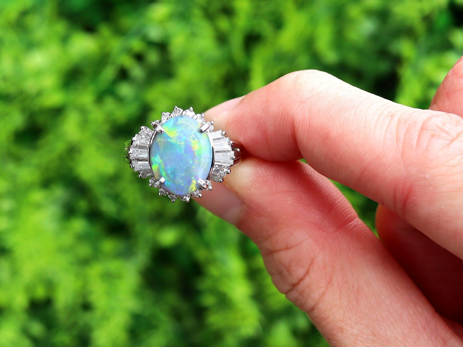 A fine and impressive vintage 2.09 carat opal and 0.89 carat diamond, platinum dress ring; part of our diverse antique jewelry and estate jewelry collections.

This fine and impressive opal and diamond cluster ring has been crafted in platinum.

The