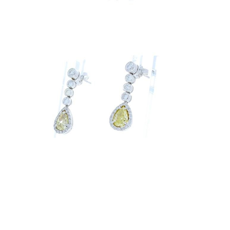 Contemporary 2.09 Carat Pear Shape Fancy Yellow Diamond Earrings in 18 Karat White Gold