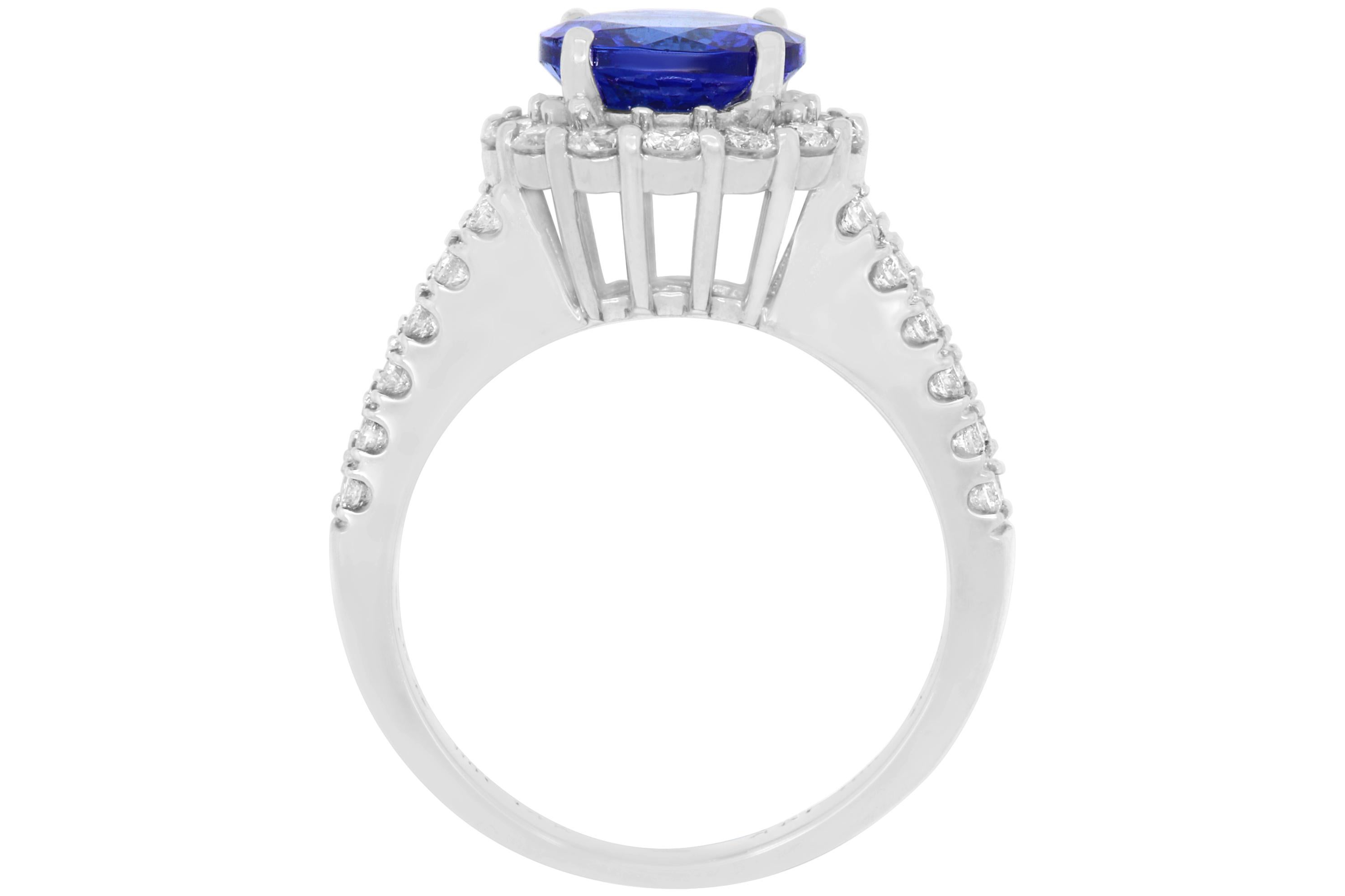 A truly stunning piece, this 2.09 Carat Round Tanzanite shines. Surrounded by brilliant white diamonds and a 14K White Gold dual band, this is a piece to treasure for years to come! 

Material: 14k White Gold 
Center Stone Details: 2.09 Carat Round