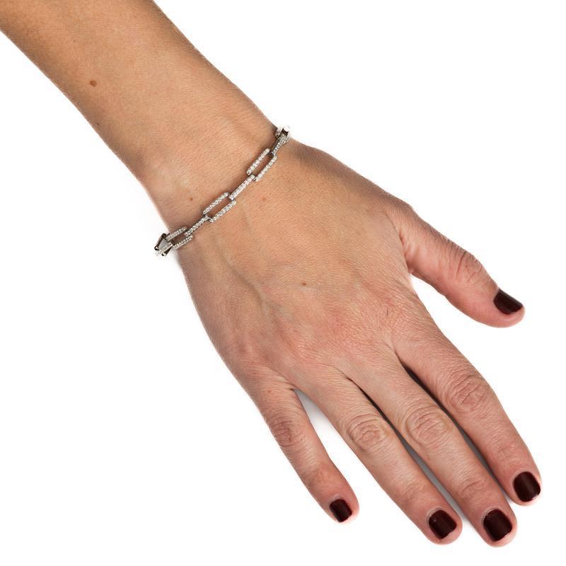 This 14 karat white gold link bracelet features 2.09 carat total weight in round prong set natural diamonds. It can stand on its own or be layered with your other favorite bracelets. Box with safety clasp. 
Measurements: Length is 7