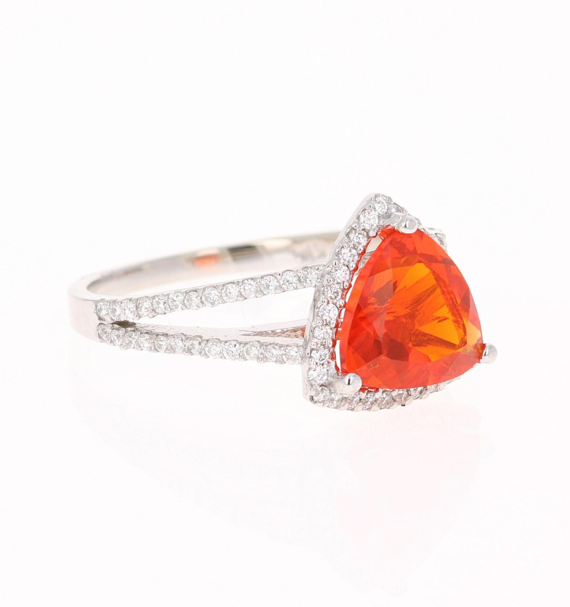 Beautiful Fire Opal and Diamond Ring!

This ring has a 1.69 carat Trillion Cut Fire Opal in the center of the ring.  The Fire Opal is surrounded by a simple Halo of 81 Round Cut Diamonds that weigh 0.40 carats (Clarity: VS, Color: F). 
The total