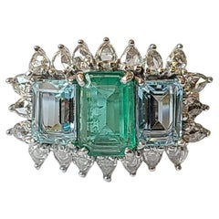 2.09 Carats, Natural Emerald, 2.49 Carats Aquamarine & Diamonds Three Stone Ring