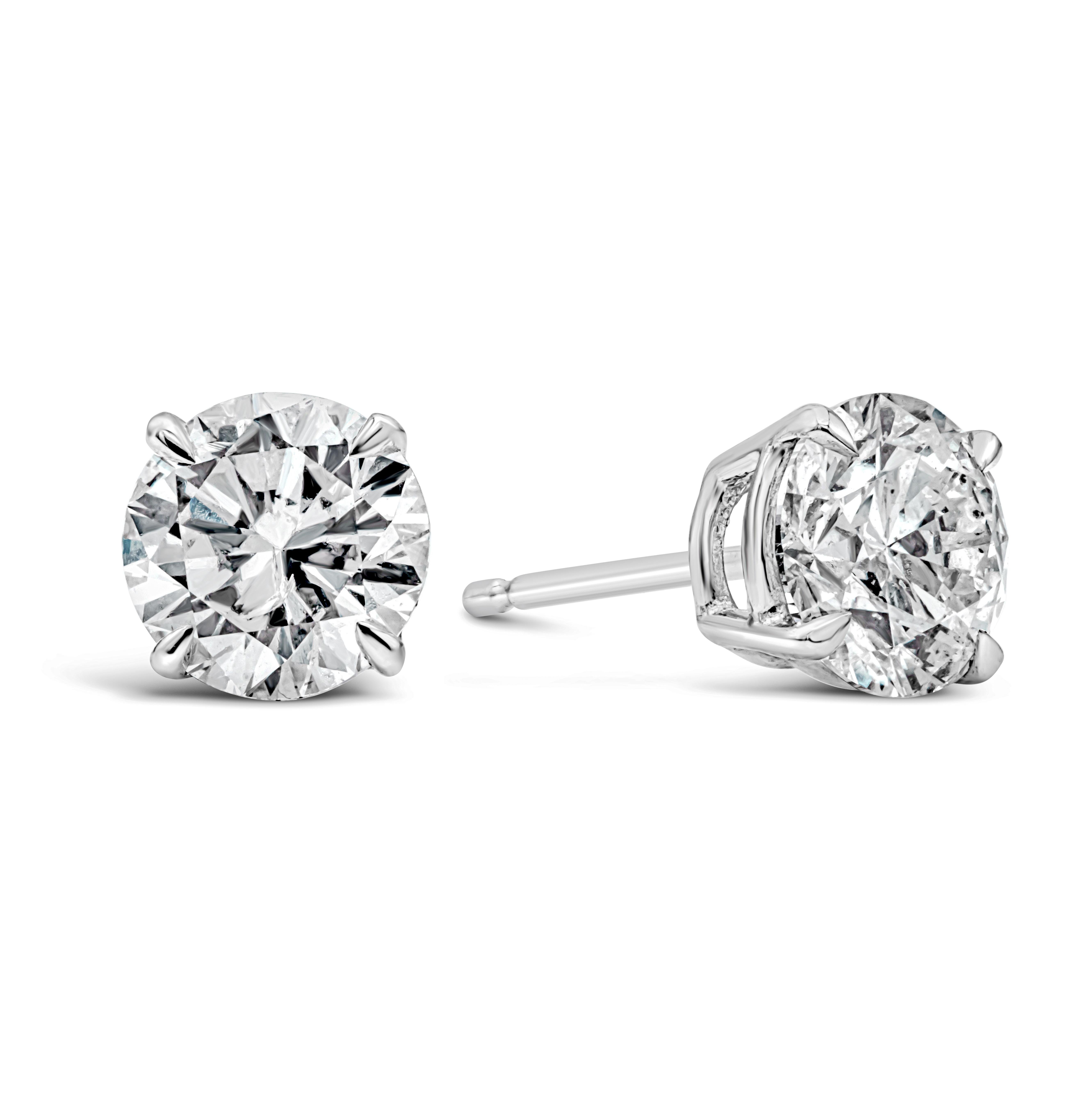 This simple yet classic style of stud earrings showcasing a pair of round brilliant diamonds weighing 2.09 carats total, set in an 14k white gold mounting. Diamonds are approximately D-E color, I1-I2 in clarity.

Roman Malakov is a custom house,