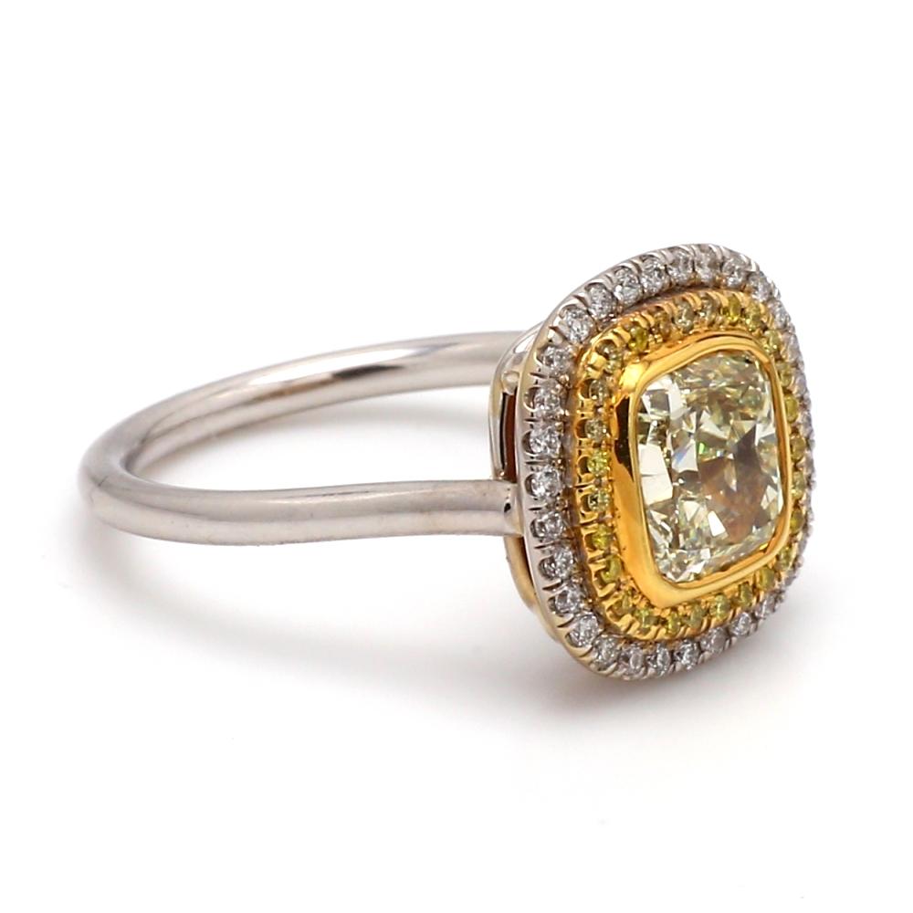 2.09ct Estate Fancy Yellow Radiant Diamond Ring Sz.7

This estate ring features a 2.09ct Fancy Yellow Radiant Diamond with VS1 clarity, set in 18K two-tone gold. Accented by 0.48ctw of round brilliant diamonds, this size 7 ring is resizable and