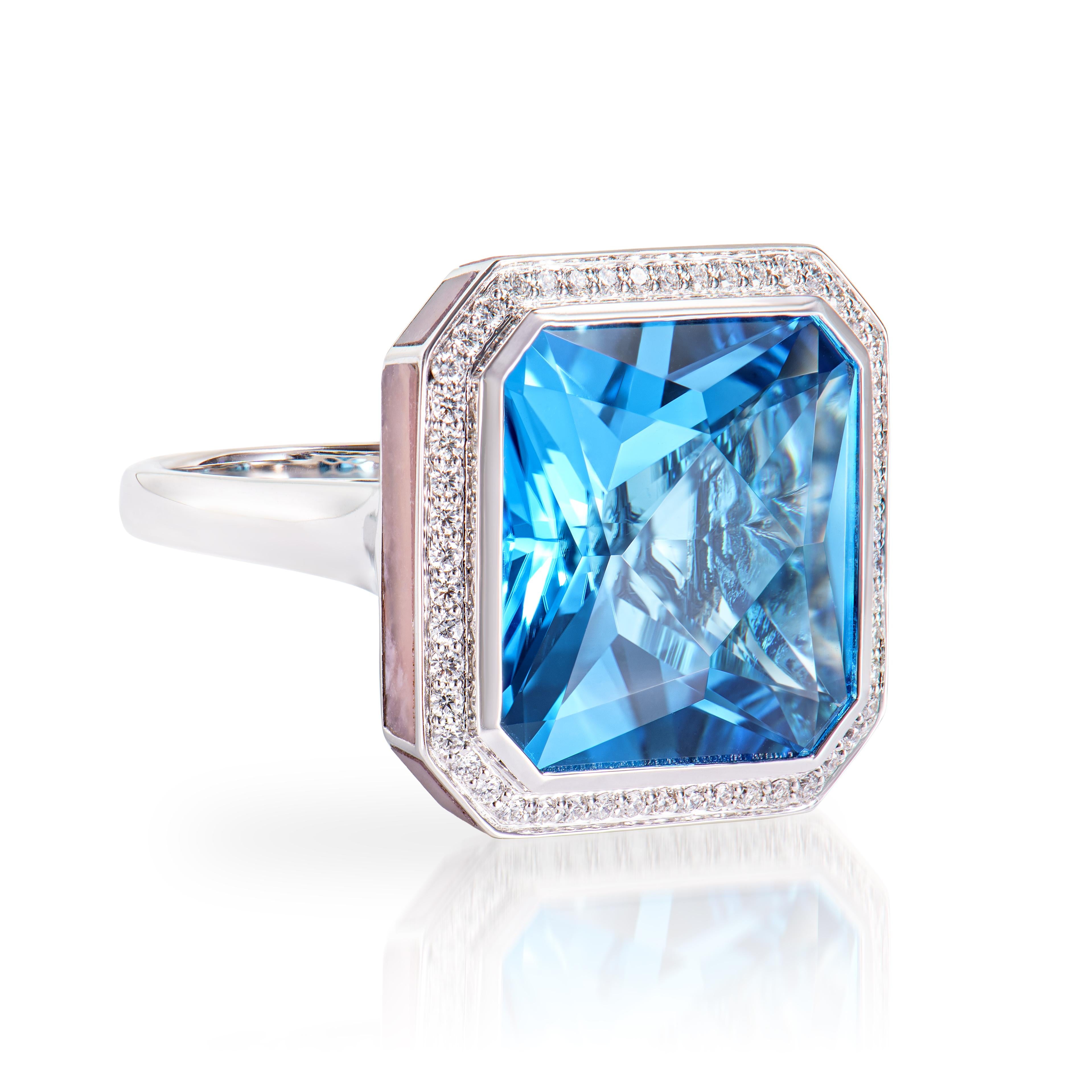 This lovely Swiss Blue Topaz ring is set in an octagon shape. The Pink Opal that embraces the ring's border adds to its beauty and elegance. This trendy ring is suitable for any event or gathering. These gemstones with diamonds are set in white gold