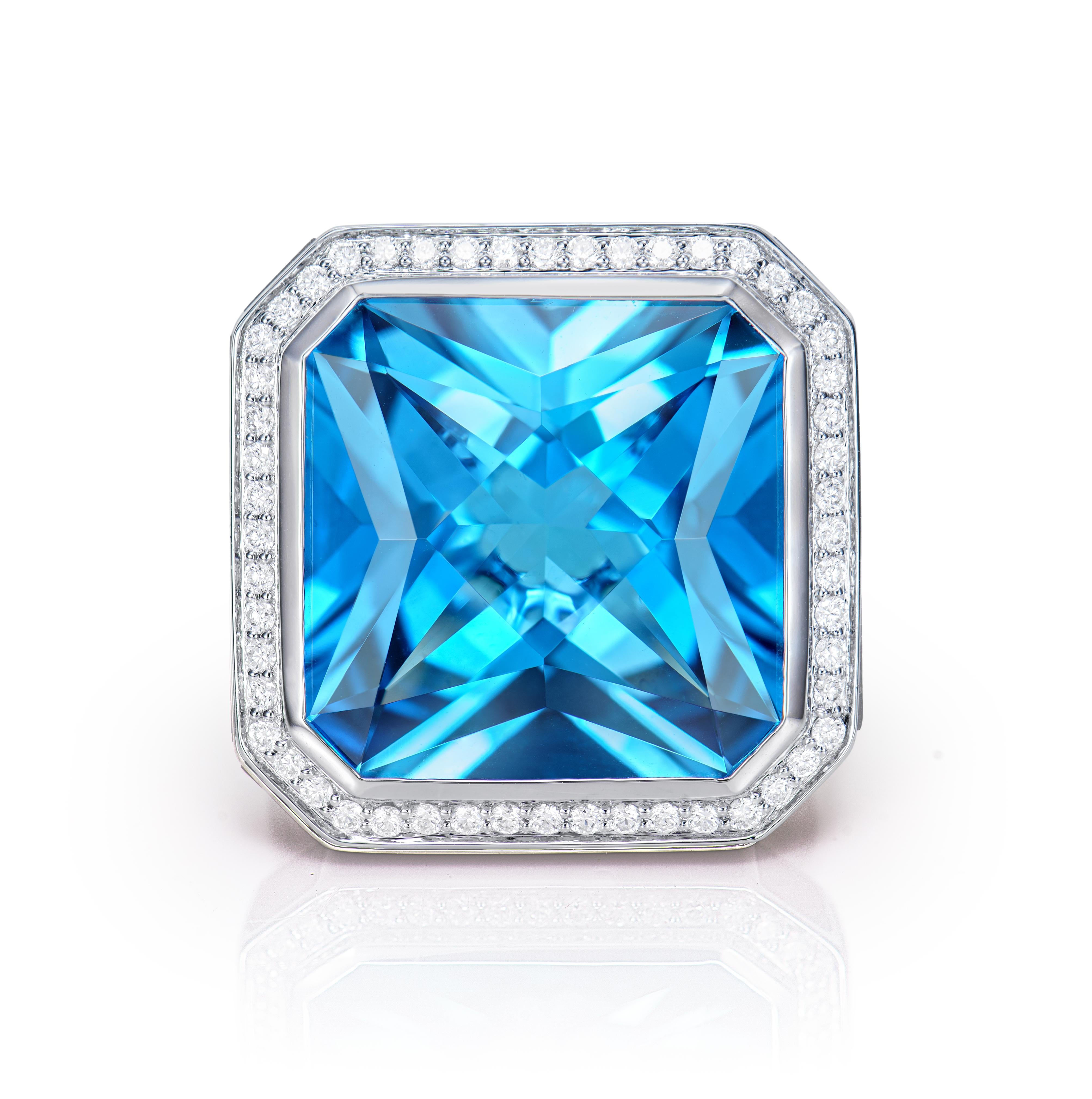 Contemporary 20.93 Carat Swiss Blue Topaz Fancy Ring in 18KWG with Opal, Garnet and Diamond. For Sale