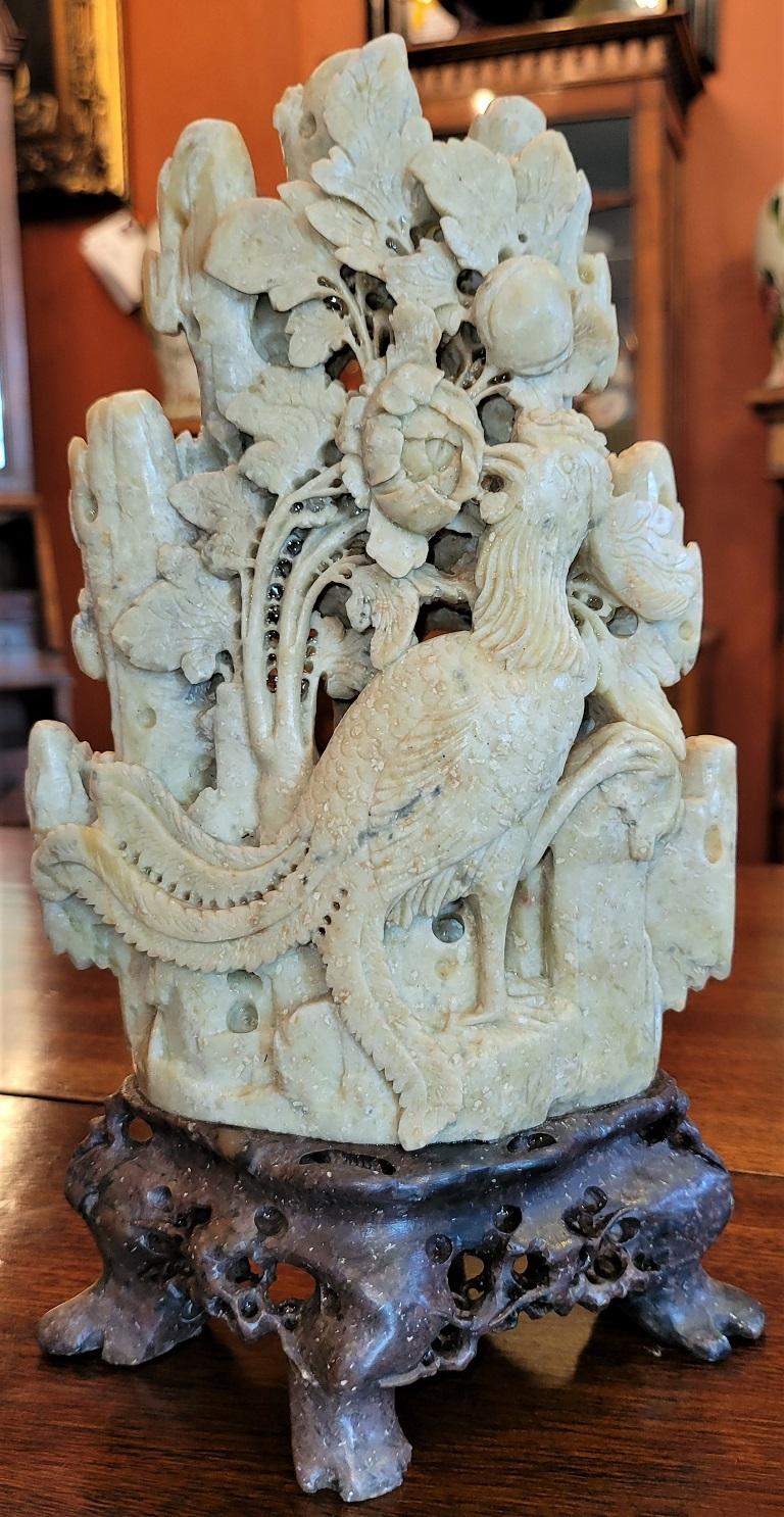Presenting a lovely 20c medium Chinese soapstone carving.

Made in China in the early 20th century circa 1930.

This is a medium/tall green and brown soapstone carving in that it is almost 10 inches tall.

Carved in relief in what appear to be