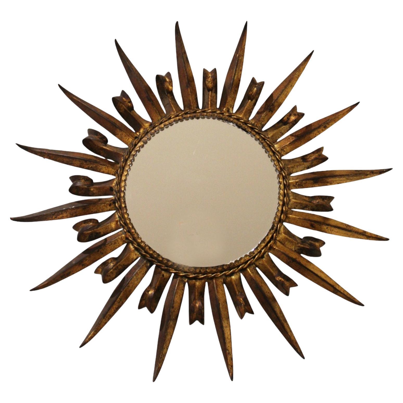 Miroir solaire en fer doré espagnol 20c en vente