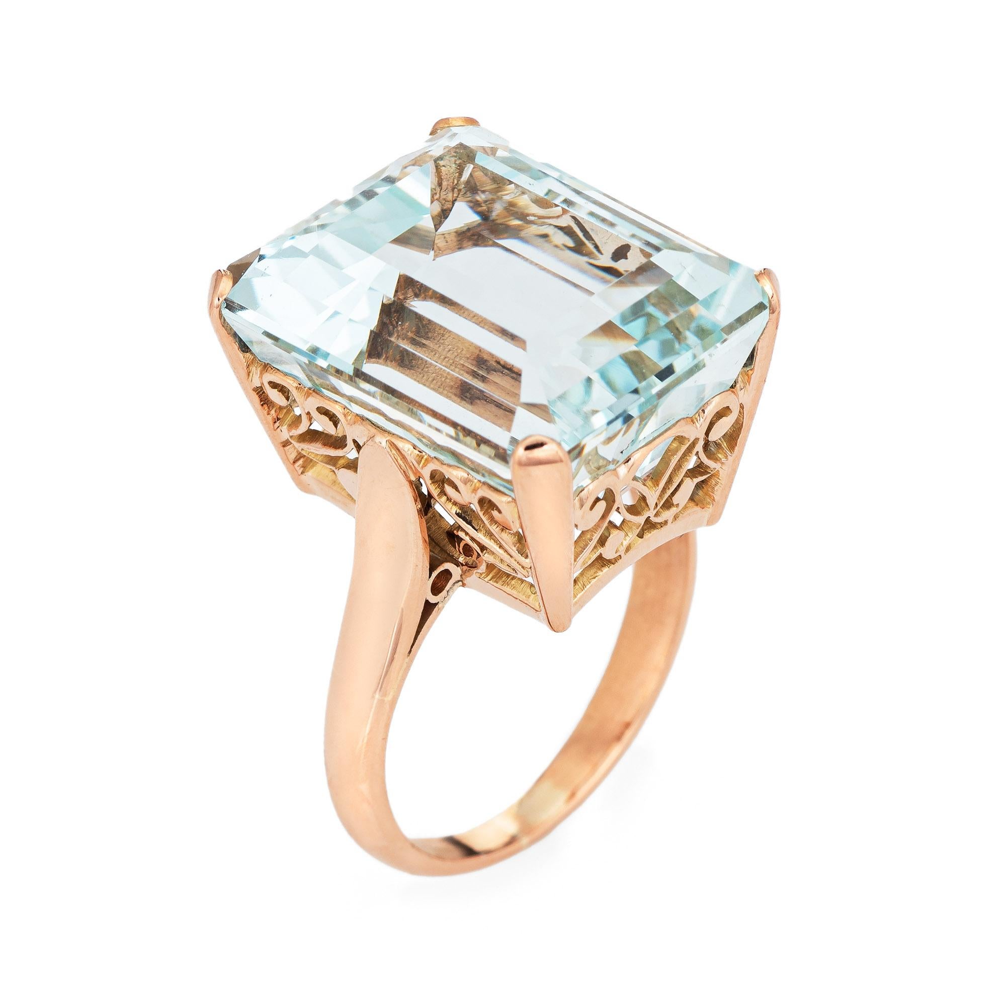 Stylish vintage estimated 20 carat aquamarine cocktail ring (circa 1950s to 1960s) crafted in 14 karat yellow gold. 

Emerald cut aquamarine measures 17.4mm x 14.4mm (estimated at 20 carats). The aquamarine is in very good condition and free of