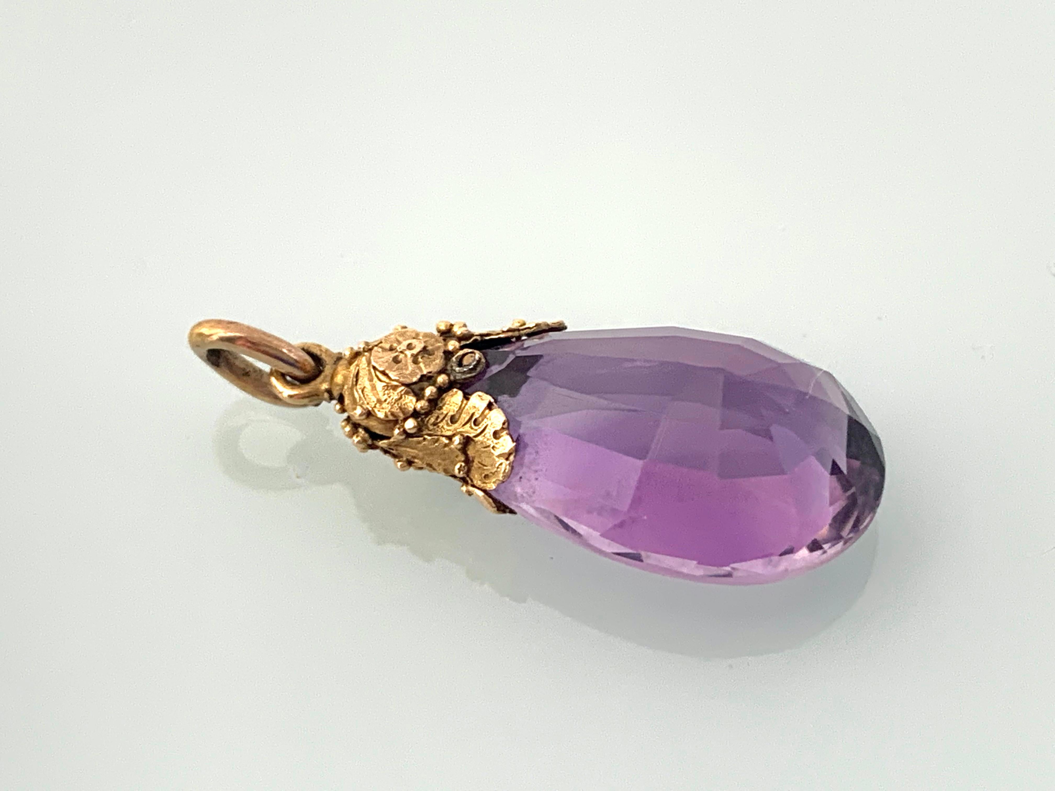 Antique Georgian 20ct Gold hand made 
foliage design mount
for a large light Catching Purple Glass faceted drop pendant.
possibly Amethyst gemstone (unable to be definite as has not been tested by an expert )
European origin 
extremely well