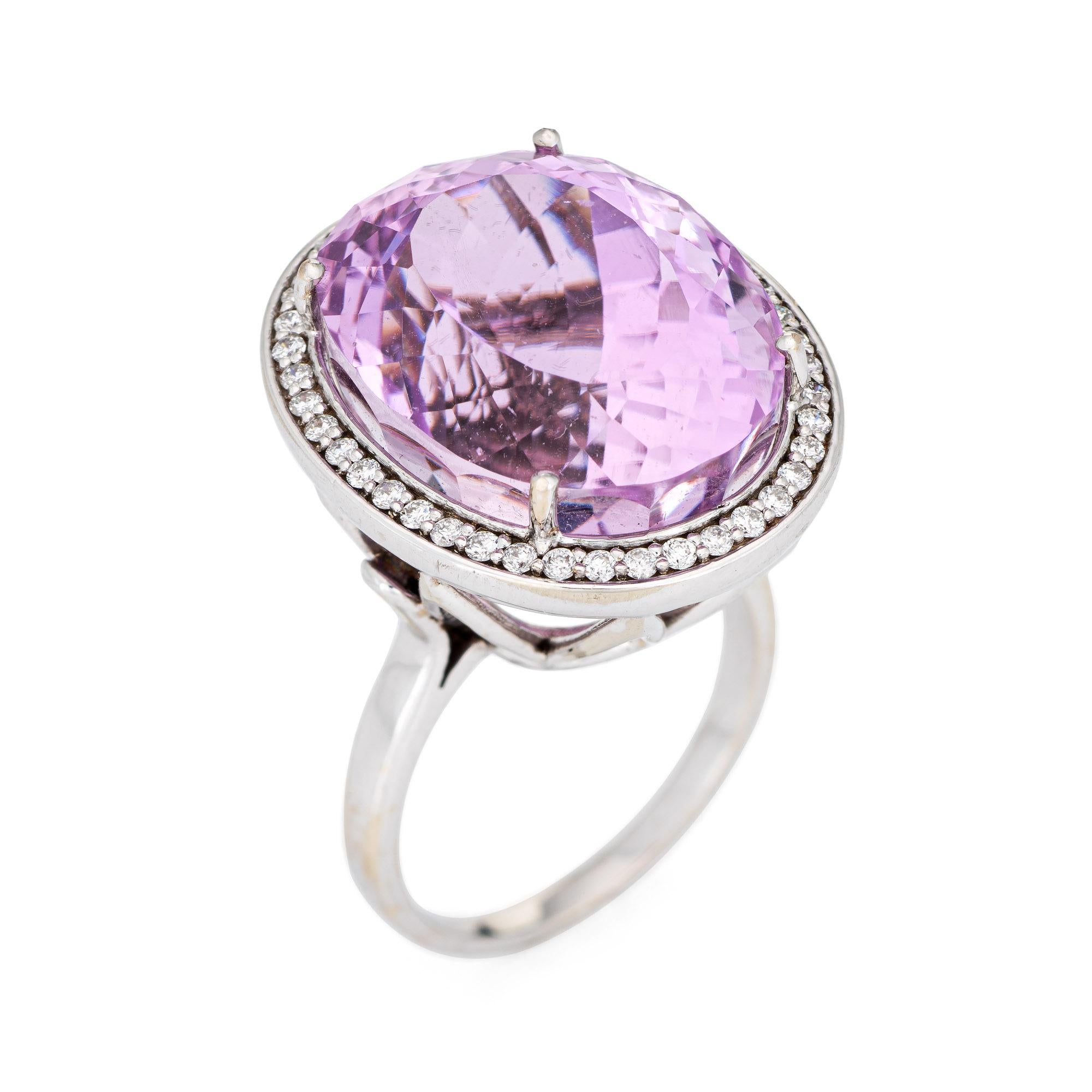 Stylish large estimated 20 carat kunzite & diamond cocktail ring (circa 2000s) crafted in 14 karat white gold. 

Oval faceted kunzite measures 19mm x 15mm (estimated at 20 carats), accented with an estimated 0.50 carats of diamonds (estimated at H-I
