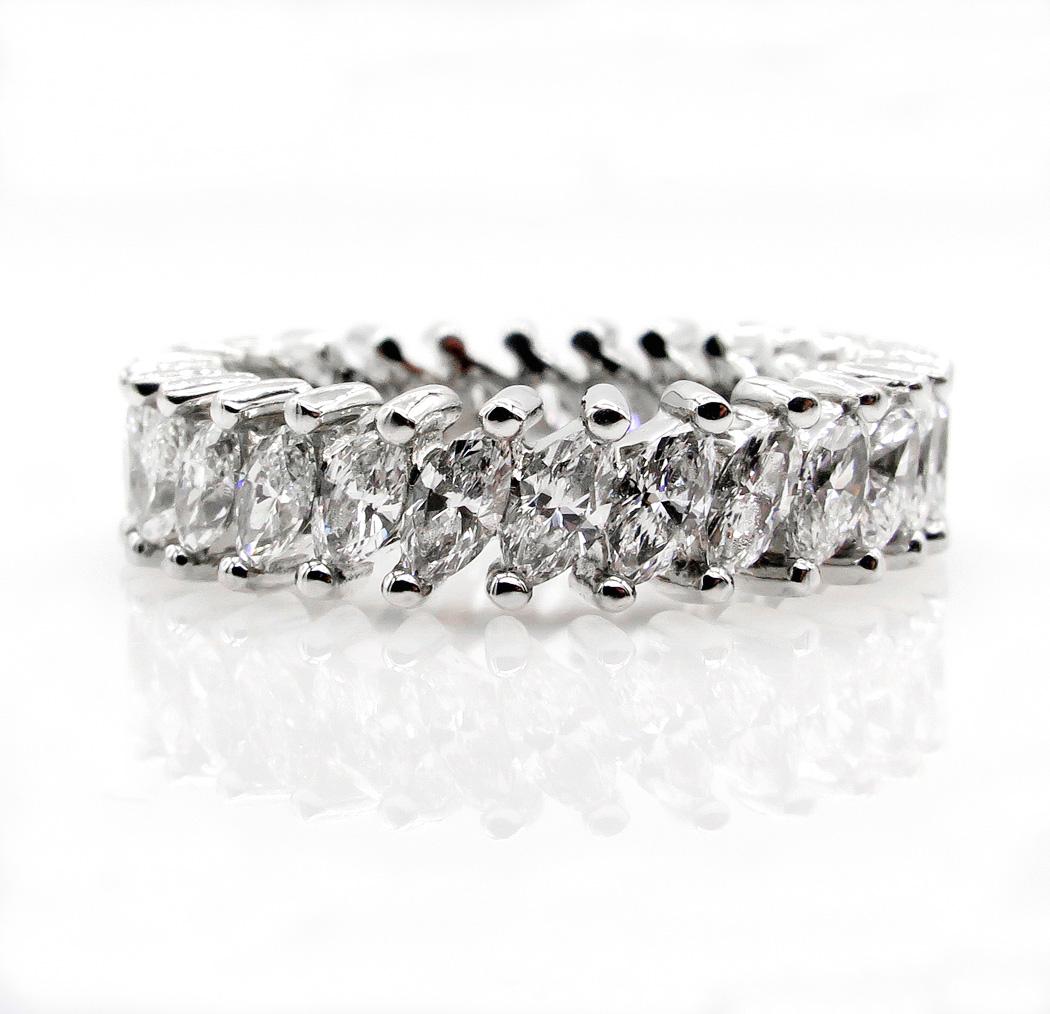 A classic Mid-Century Diamond and 14k White Gold Anniversary full ETERNITY band sparkling all around.
Bright dazzling Marquise brilliant-cut diamonds form a beautiful line of dancing light, with the kind of rich, slow flashes and sparkles that can