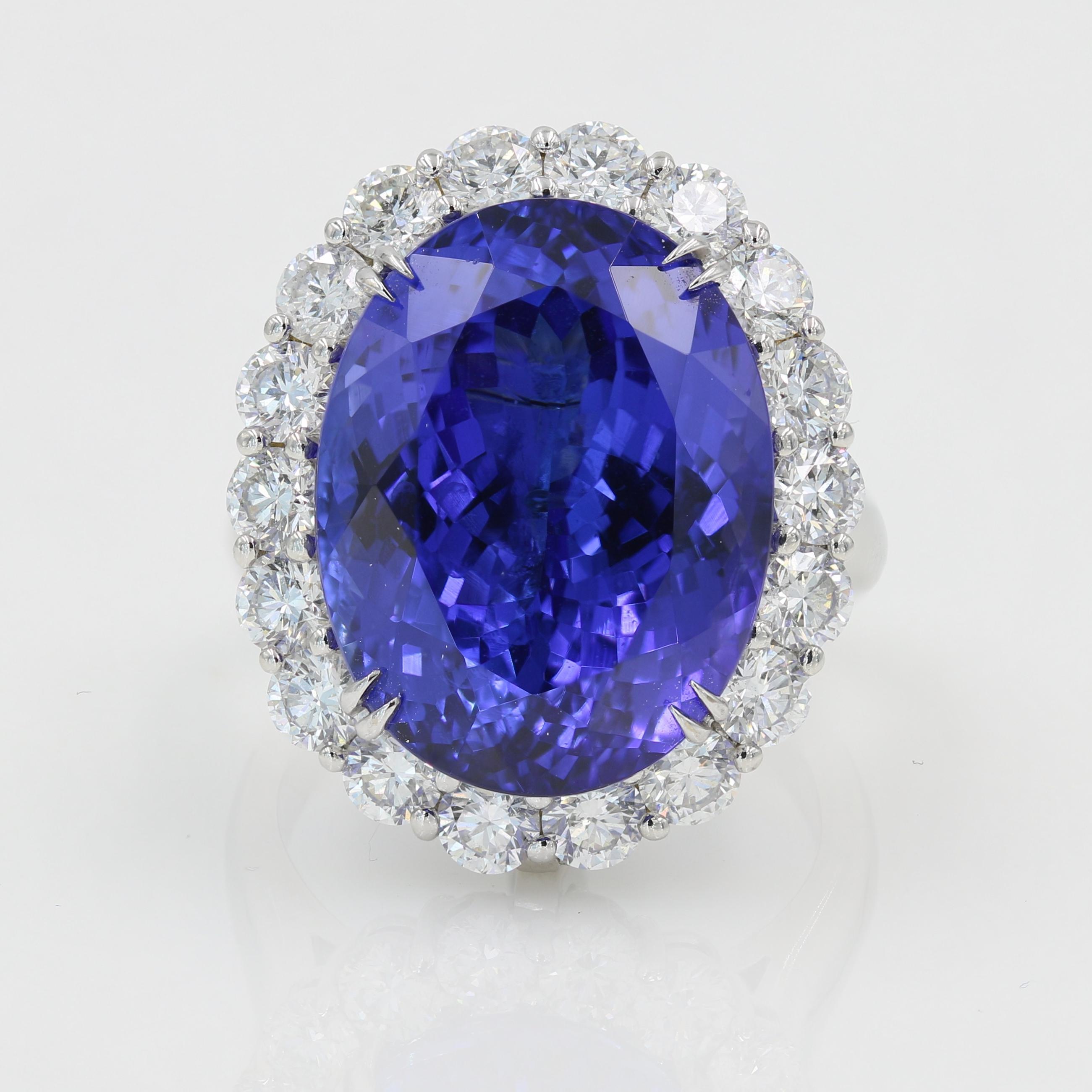 20cts Tanzanite & Diamond Ring/Pendant in 18k WG -

18kt. White Gold Tanzanite & Diamond Ring/Pendant, featuring an oval cut Tanzanite that weighs approximately 20.70cts., 22 Round cut Diamonds = 2.52cts. total (G-H / VS).  The top of the ring is