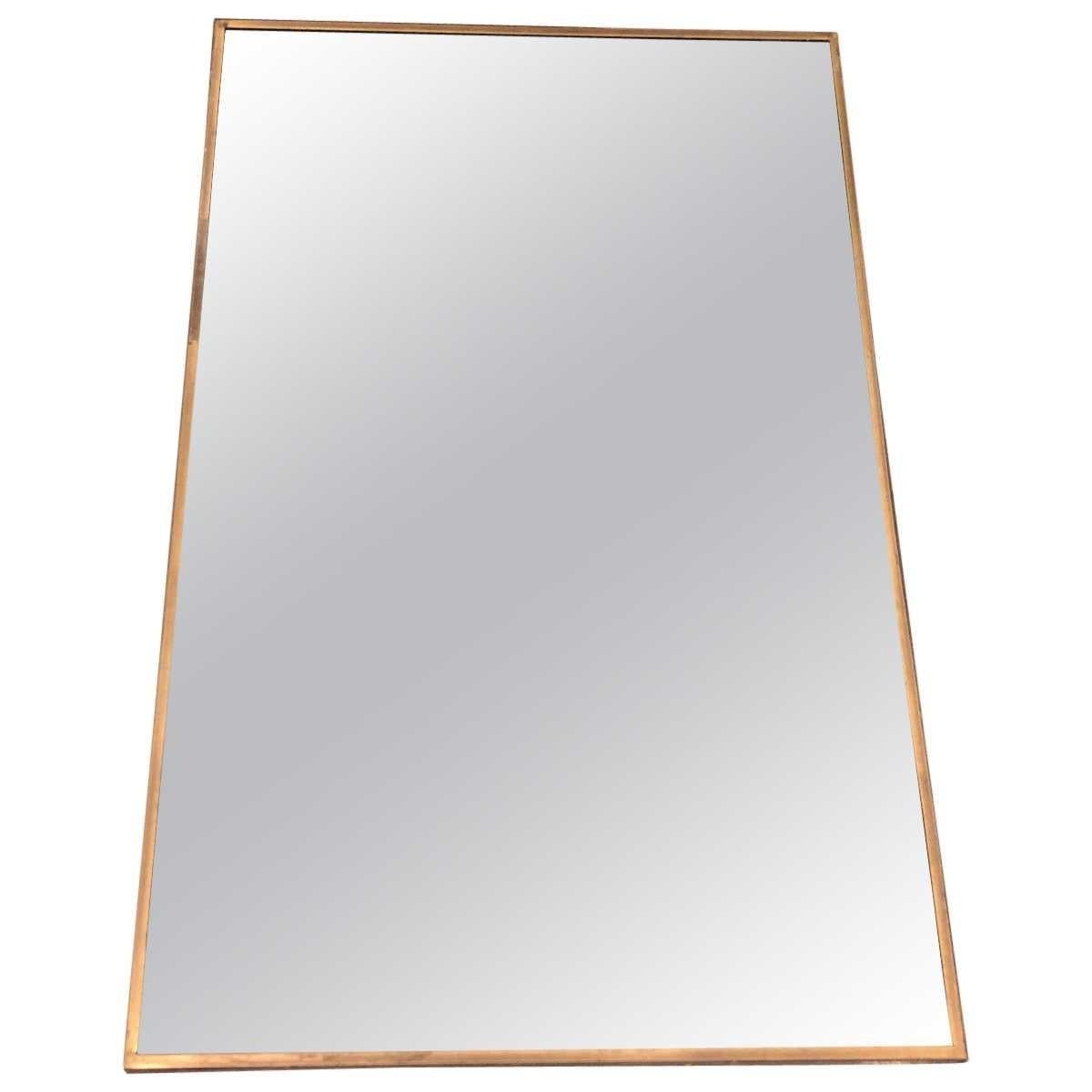 Mirror.
Antiqued brass X-form base.

Materials: Antiqued brass, mirrored glass
Dimensions
Width 19