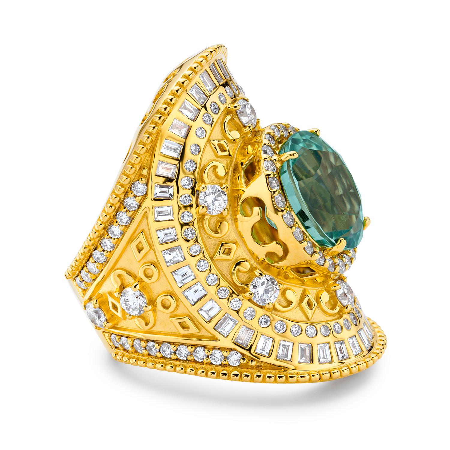 The 20K Yellow Gold Wrap Ring by Buddha Mama is an extraordinary piece that showcases a stunning 15.36ct green tourmaline centerpiece, enveloped by 2.13ctw of brilliant diamonds. This 33mm wide ring is crafted from luxurious 20K yellow gold,