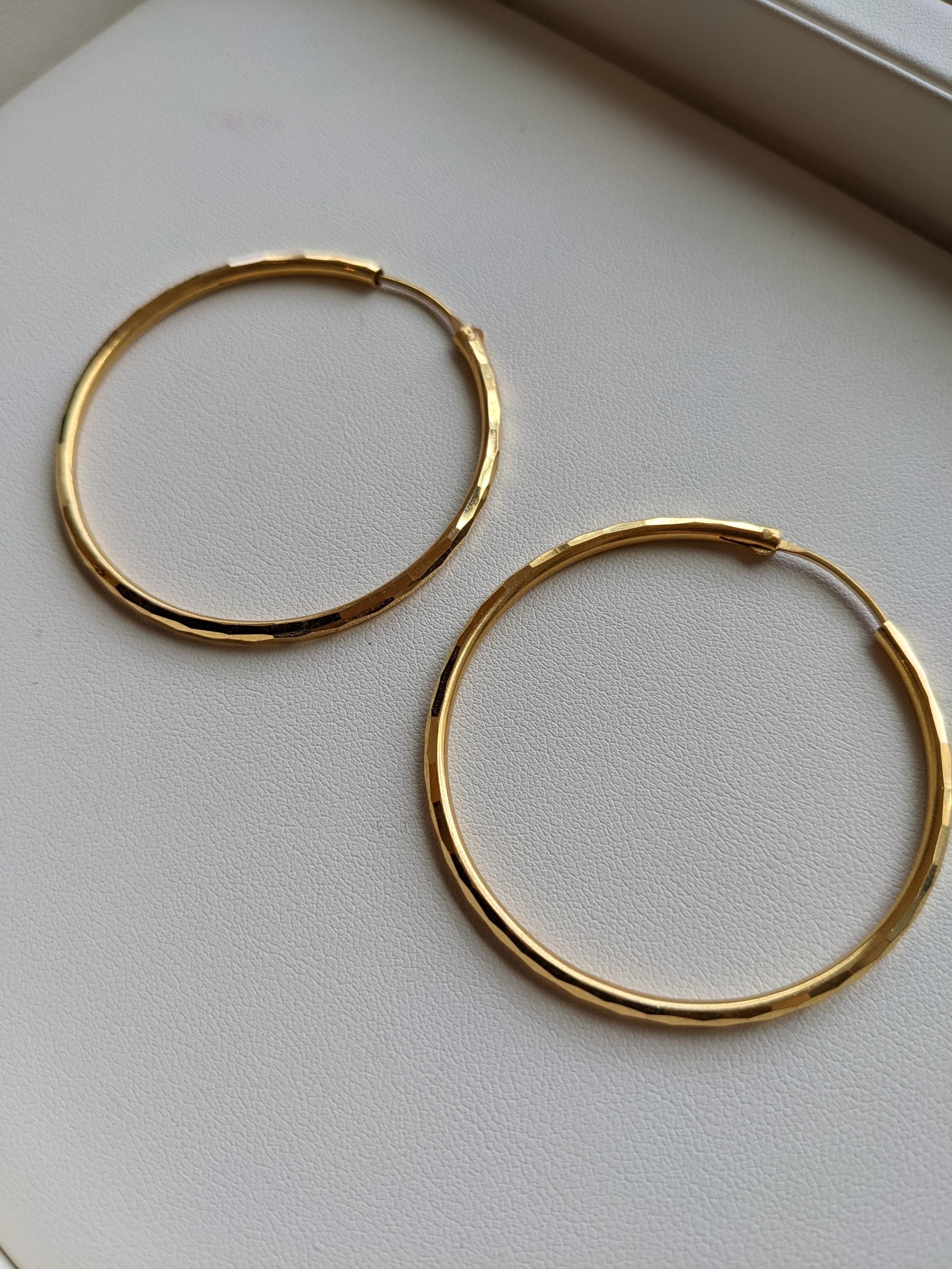 These lovely sparkly hoop earrings are authentic antiques from India. They are a gorgeous deep yellow colour due to the high karat of gold. They are in excellent shape and have minimal signs of wear and tear. They have a flex post that fits inside