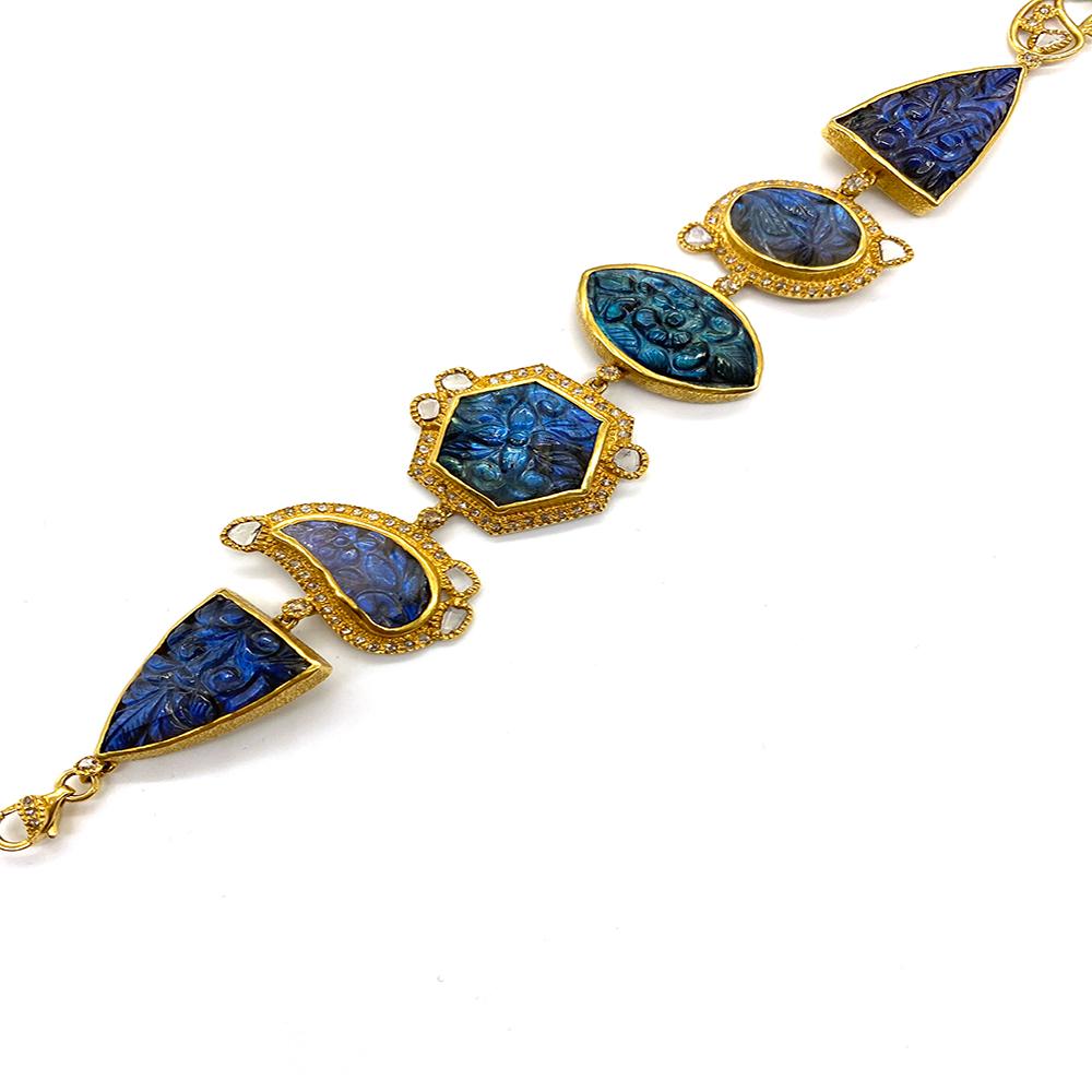 Affinity 20 Karat Yellow Gold Bracelet with Carved Labradorite, Diamonds, Sapphire, and Opals. This One-Of-A-Kind Piece Contains 76.96 Carat Carved Labradorite, 1.88 Carat Diamonds, 2.03 Carat Opals, 0.33 Carat Pink and Orange Sapphire.

Length: 7