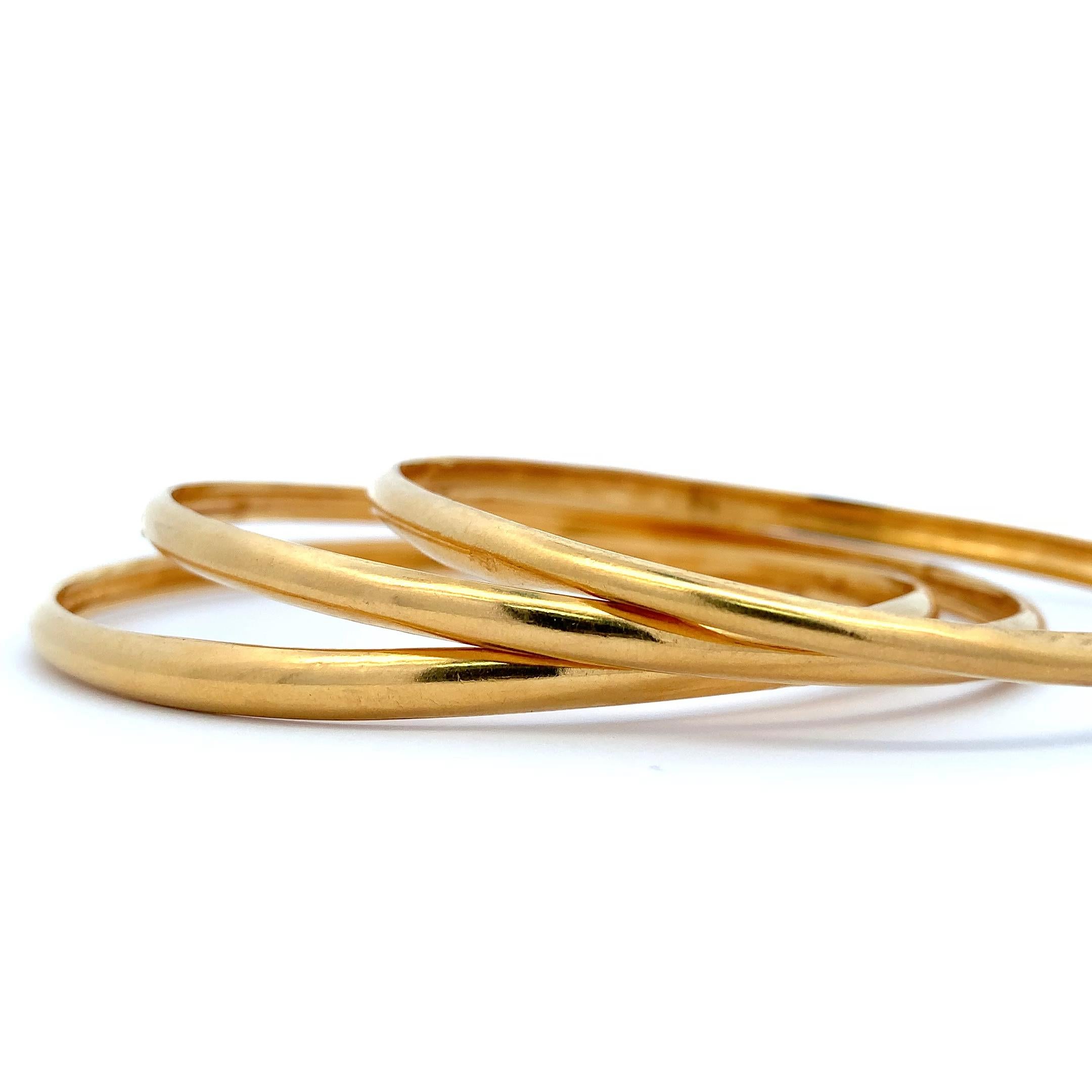 Women's or Men's 20k Yellow gold matching plain bangle bracelets For Sale