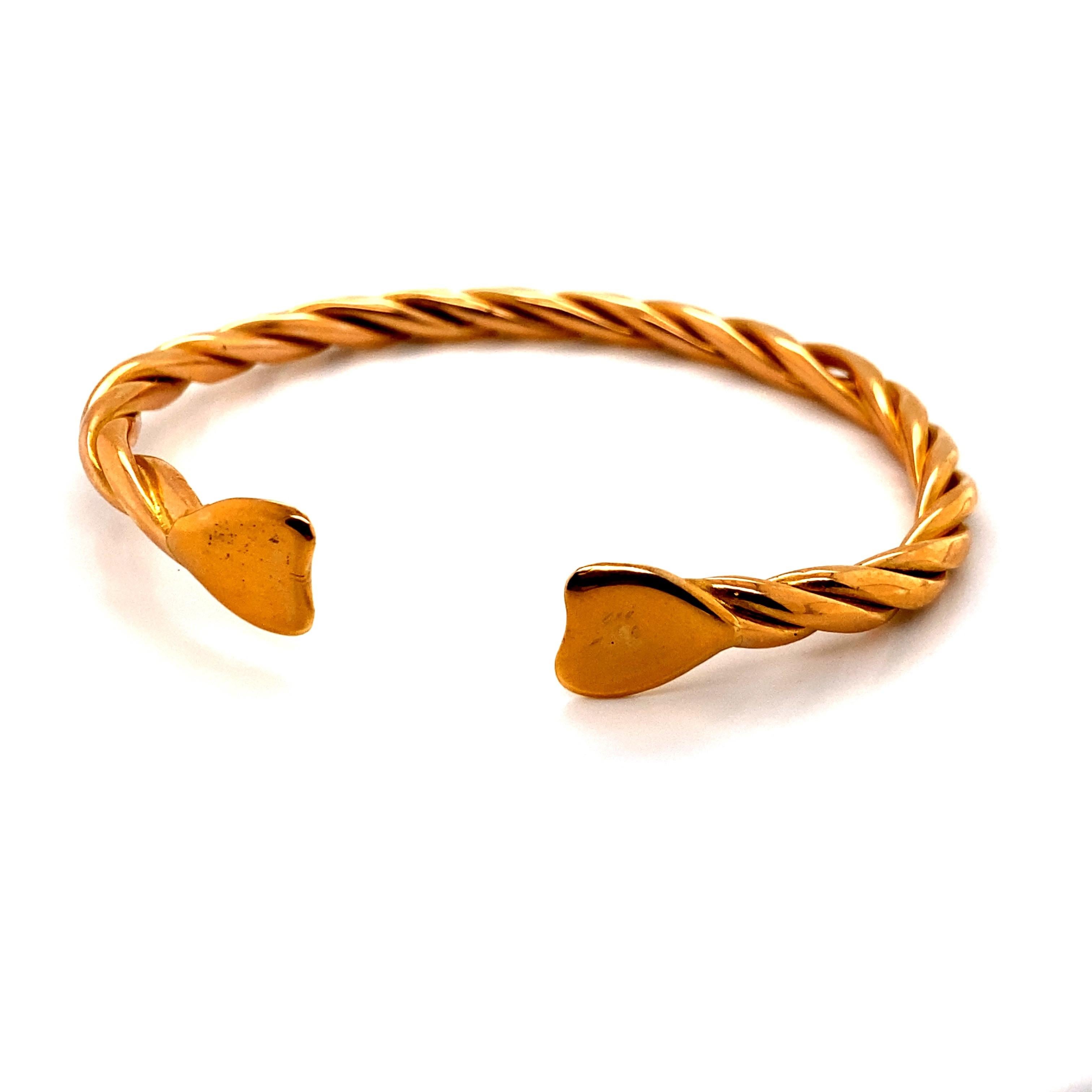 20K Yellow Gold Twist Cable Cuff Bangle Bracelet - The width of the cable is 5mm. The inside diameter is 2.25 inches high and 2.5 inches wide. The bangle weighs 42.13 grams.
