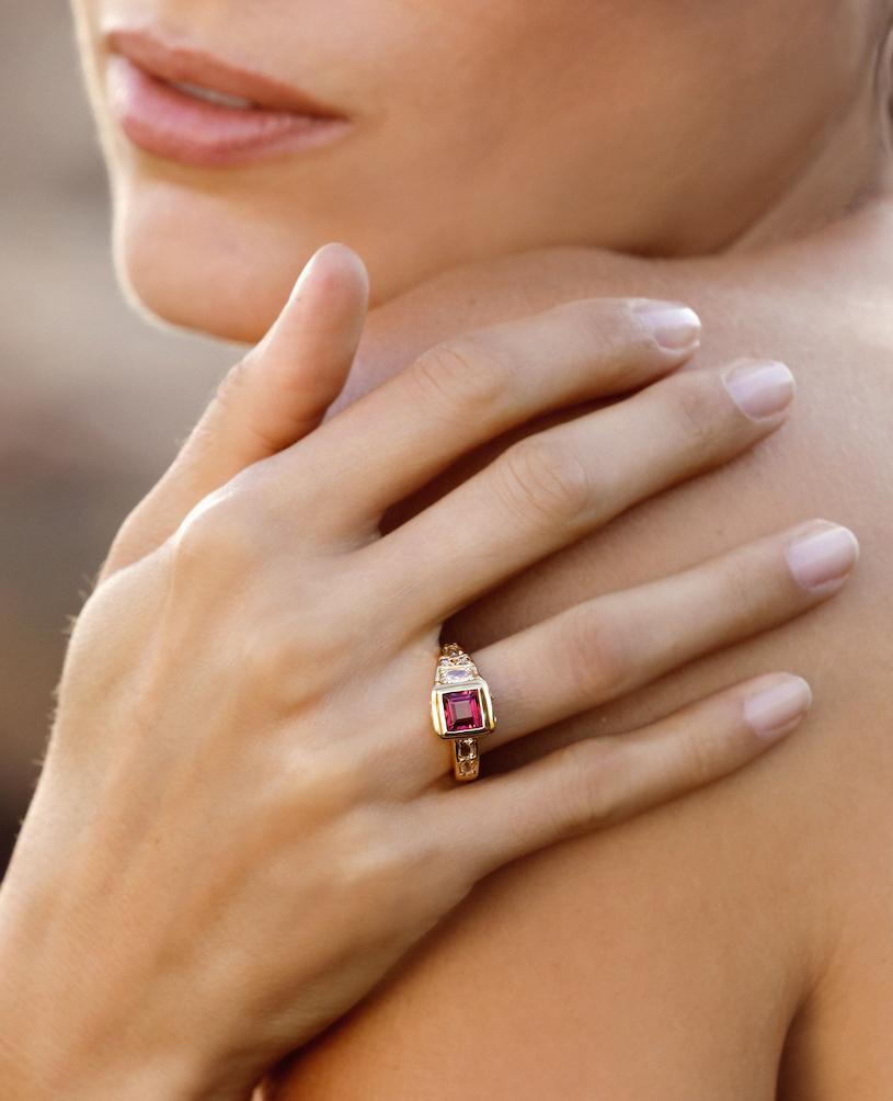 This one-of-a-kind Treasure ring incorporates a beautifully rich step cut pink tourmaline and fine white rose cut diamonds. The asymmetric design and novel placement of diamonds provides lasting interest. While vivid and eye-catching, this piece is