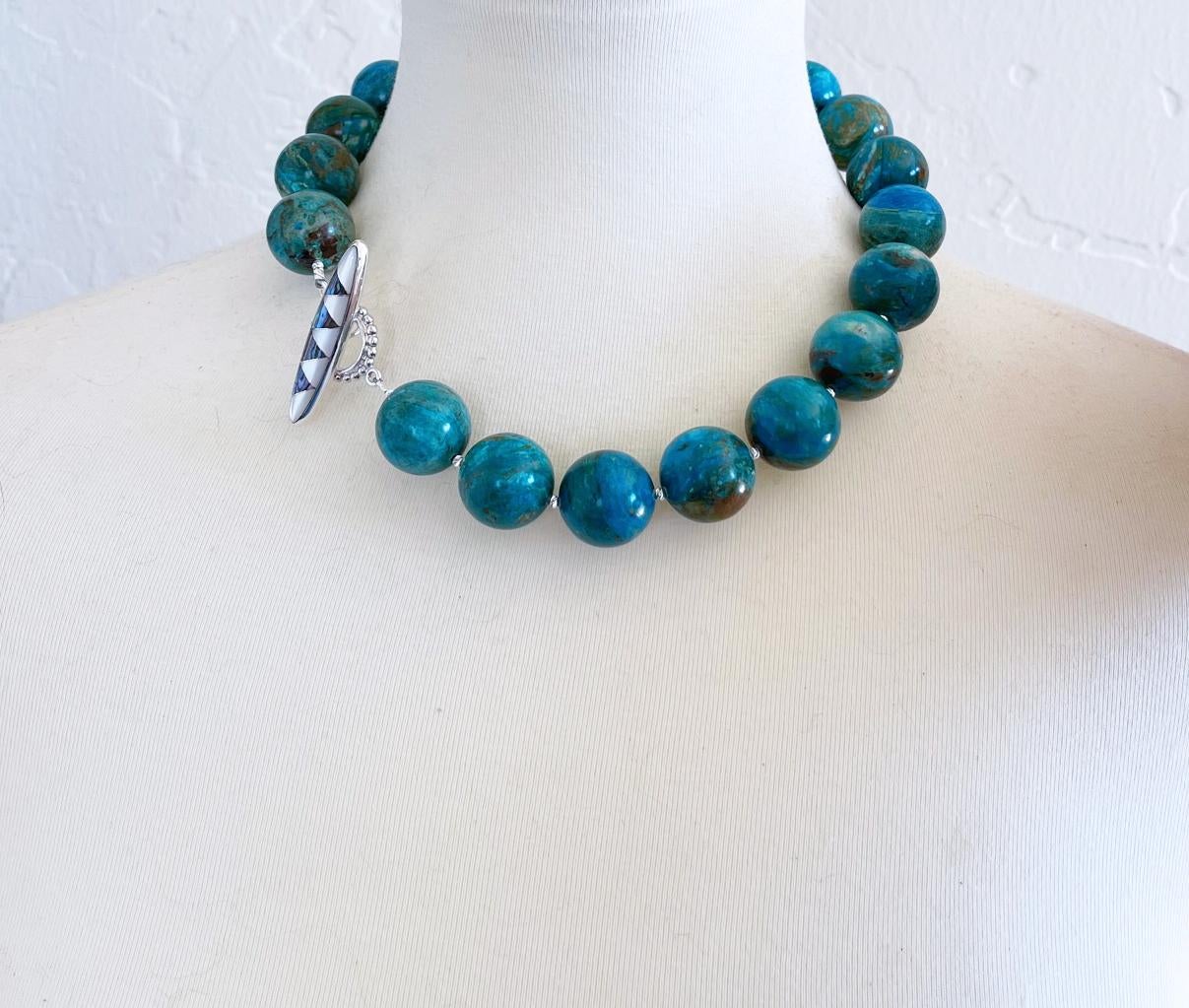 Gorgeous one of a kind superb quality 20mm round natural Peruvian blue opal beaded necklace with tiny sterling silver accent beads and finished with an elegant sterling silver toggle clasp with abalone shell and mother of pearl inlay. Handcrafted in