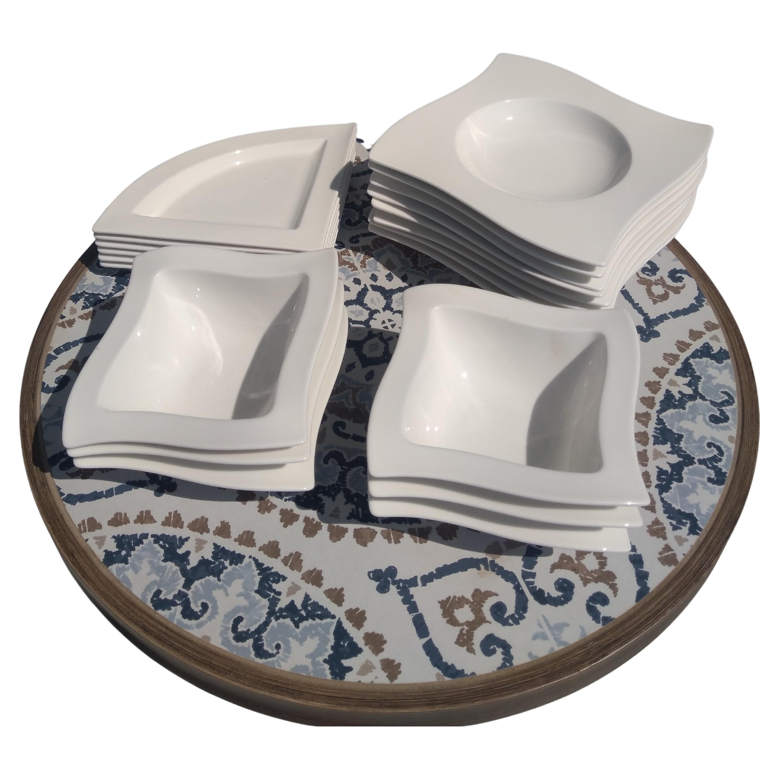 This is a highly sought out set of dish ware by Villeroy and Boch. These are styled in the wavy pattern.  The set includes 8 bowls, 6 rectangular plates and 6 small bowls.. Villeroy and Boch is a company that is located in Germany.