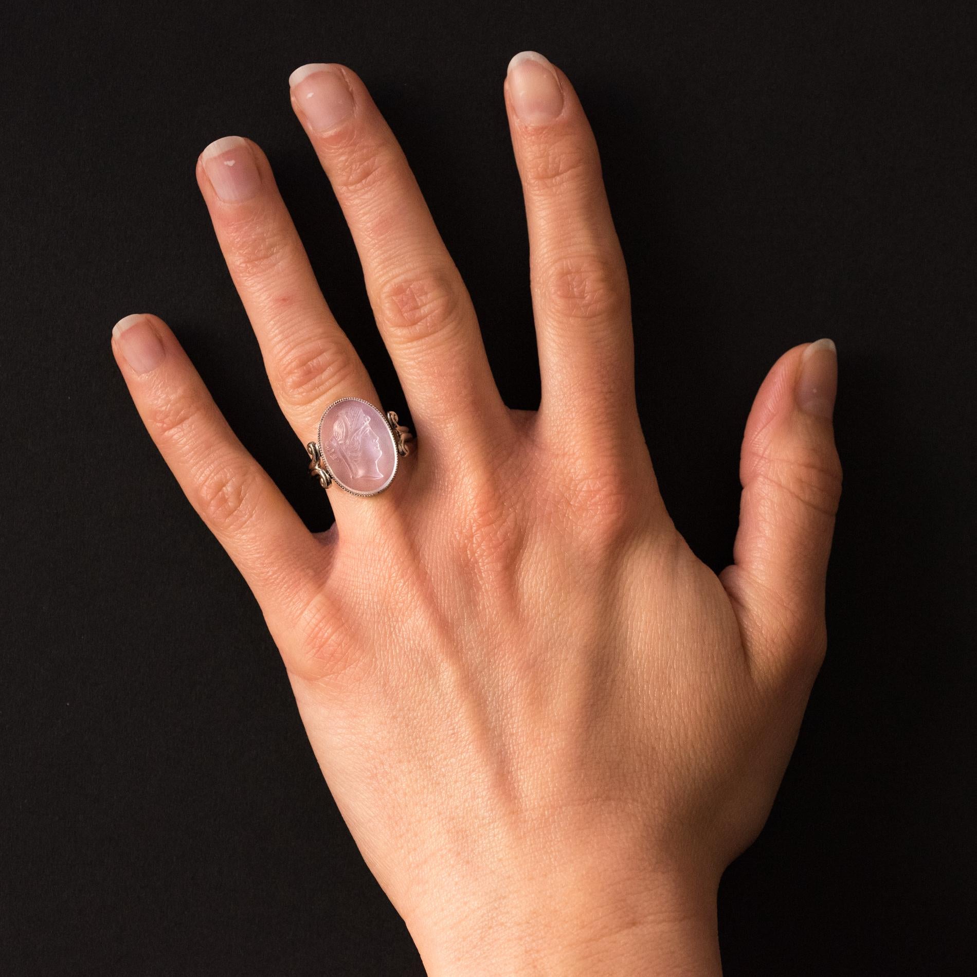 Ring in 14 karats white gold.
Lovely charming ring, it is closed- set by a moonstone cameo representing a woman’s profile with her hair up. The ring starts with a double arabesque.
Height: approximately 18.8 mm, width: approximately 13.7 mm,