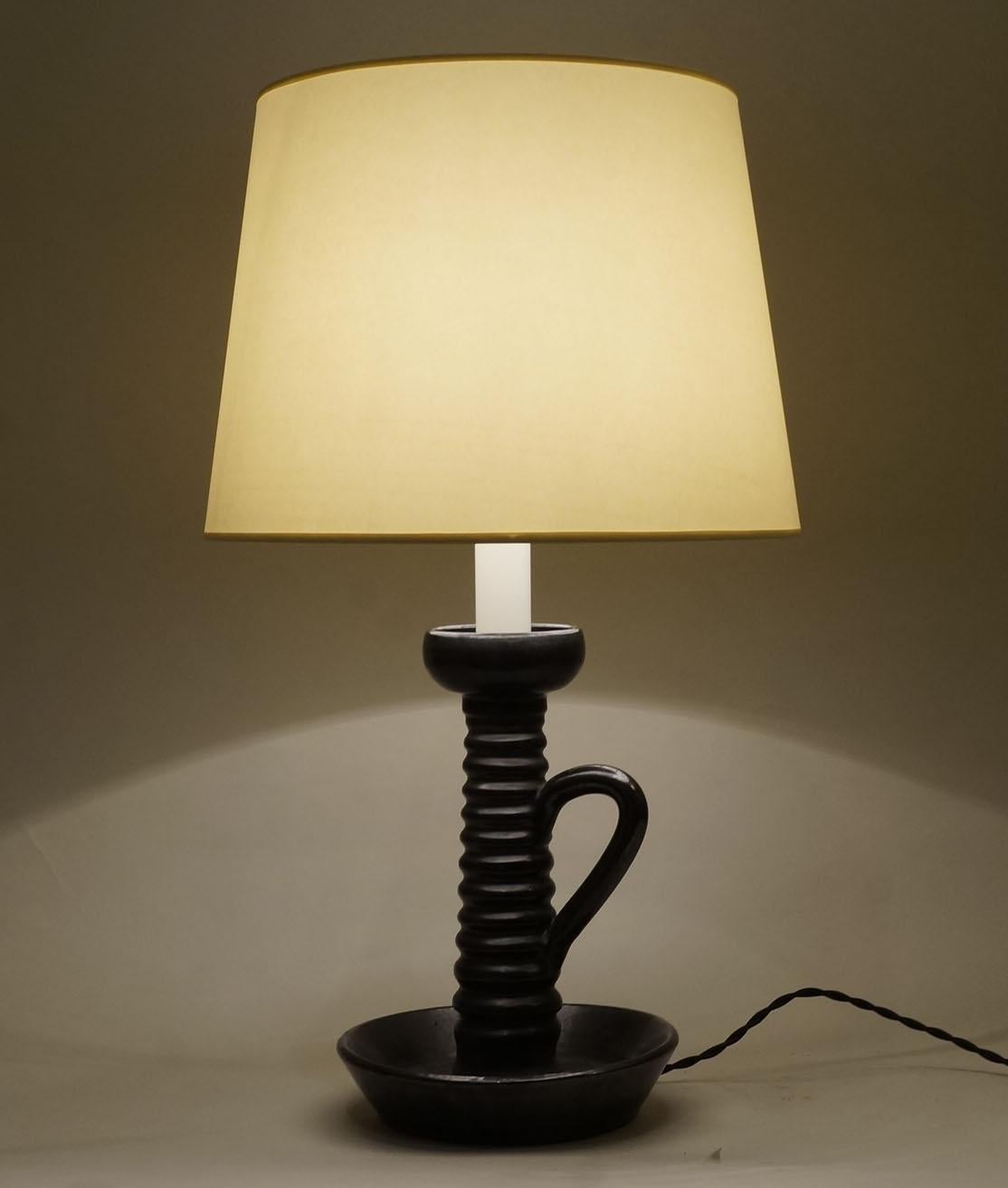 Black satin ceramic candleholder table lamp.
Custom made fabric lampshade.
Rewired with twisted silk cord.

Measures: Ceramic body height: 25 cm - 9.9 in.
Height with lampshade: 51 cm - 20.1 in.