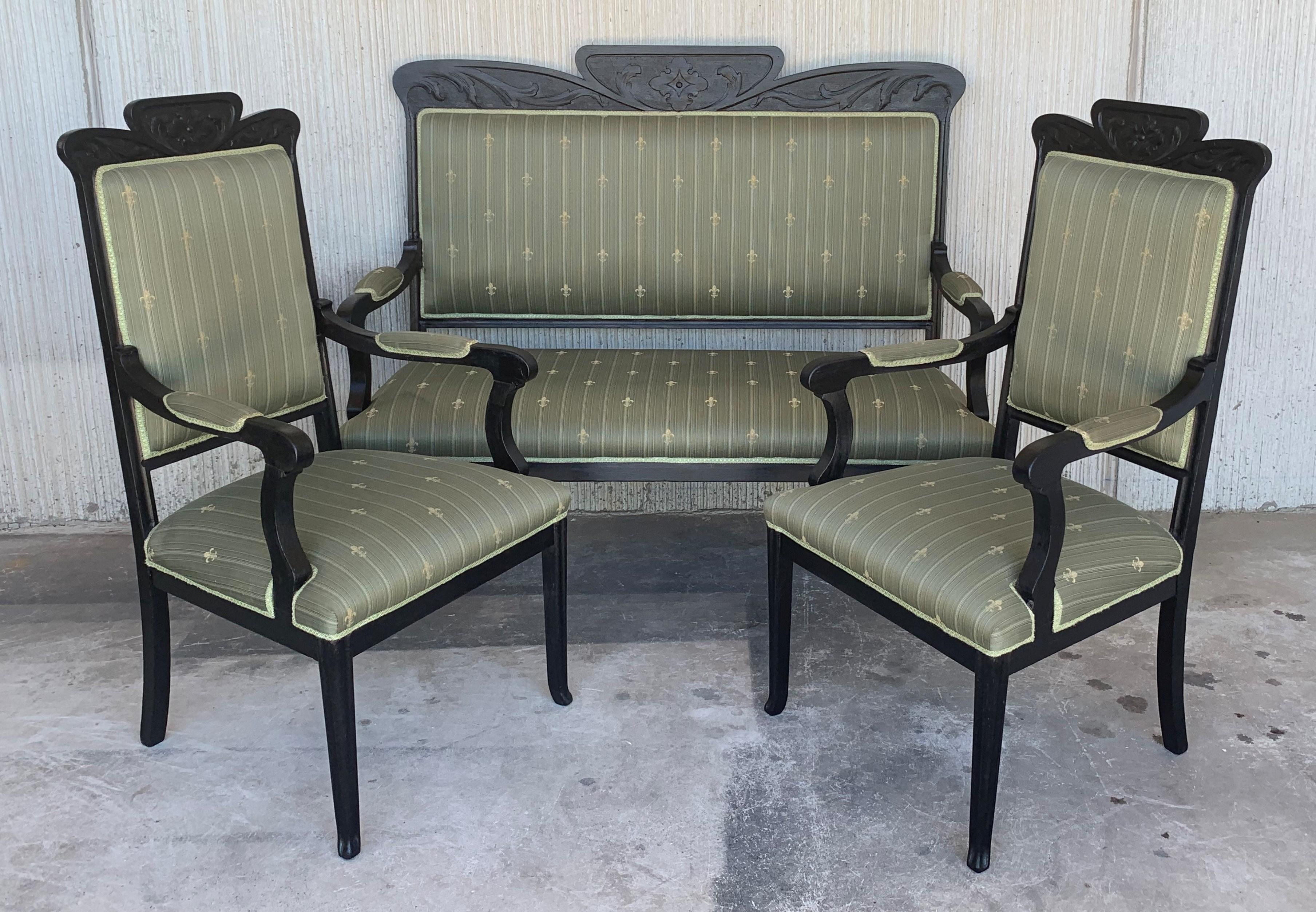 Seating furniture suite and two armchairs in the Louis Seize style in ebonized black
Solid beechwood, carved and polished. Straight backrest frame. Frame with relief carved frame. The seat and backrest are finished with a Classic upholstery. The