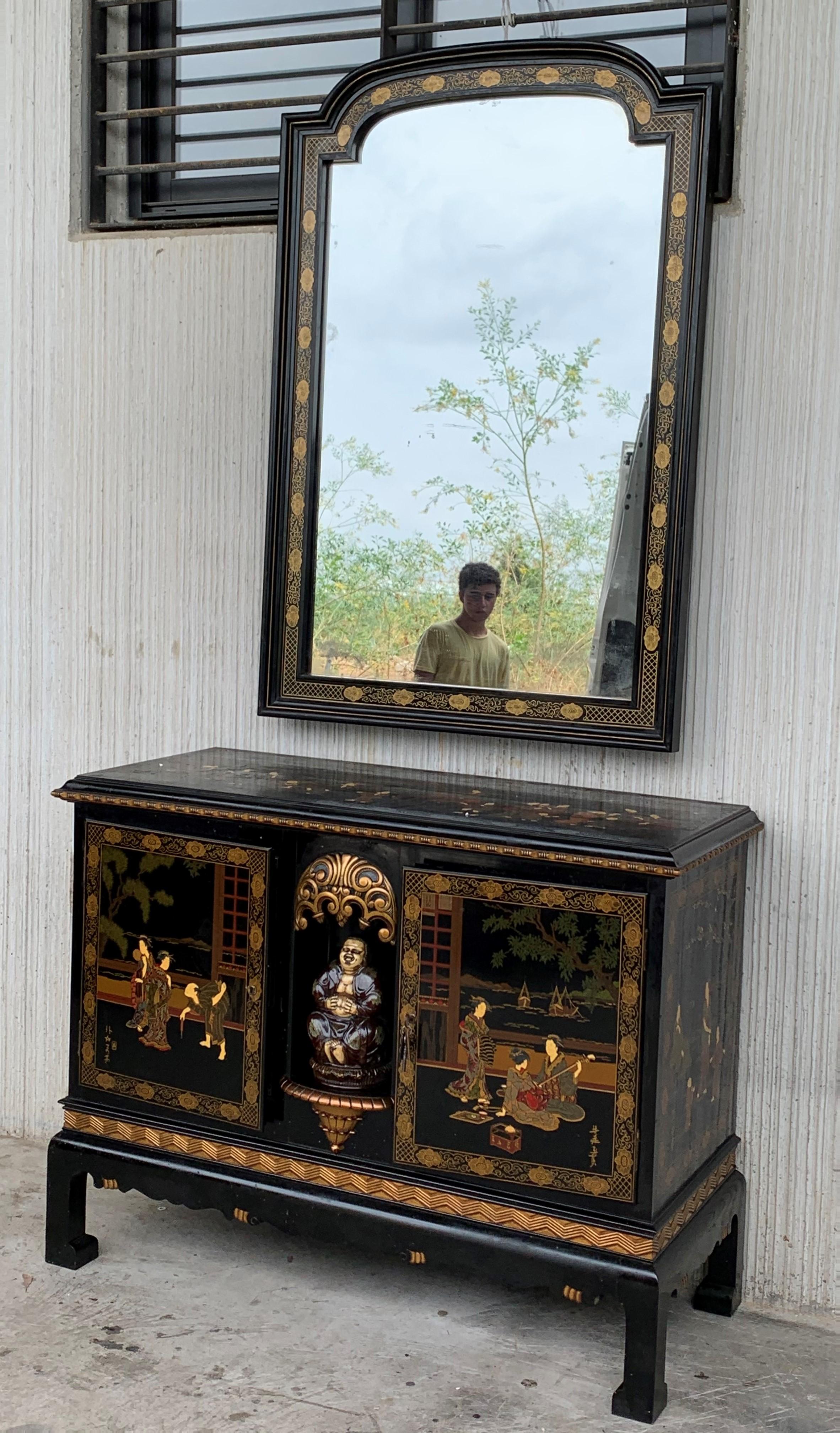 This incomparable chinoiserie black lacquer sideboard depicts figures in various typical traditional scenes. What more can you ask for really? As if that's not enough, there's plenty of traditional hand painted Asian motif from head to toe. The reds
