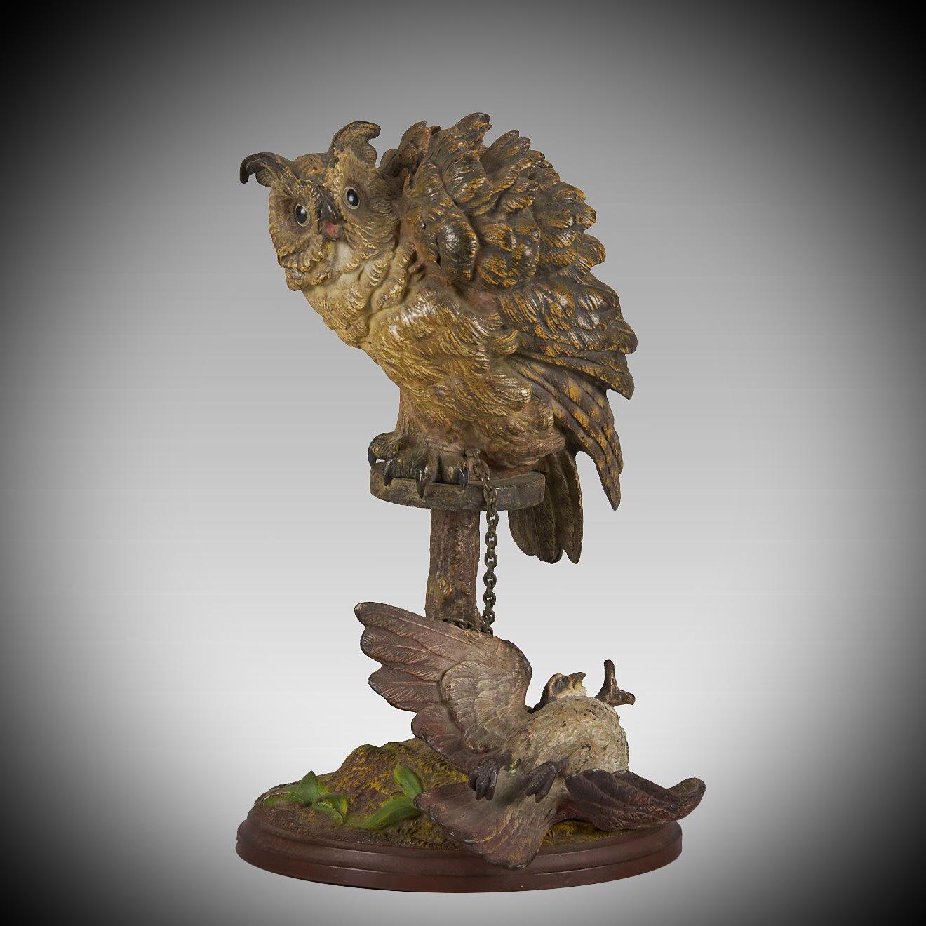 An excellent early 20th century Austrian bronze study of a hunting owl seated on its perch with gamebird below, the surface of the bronze with cold painted naturalistic colours and very fine hand finished surface detail, signed with the Bergman 'B'