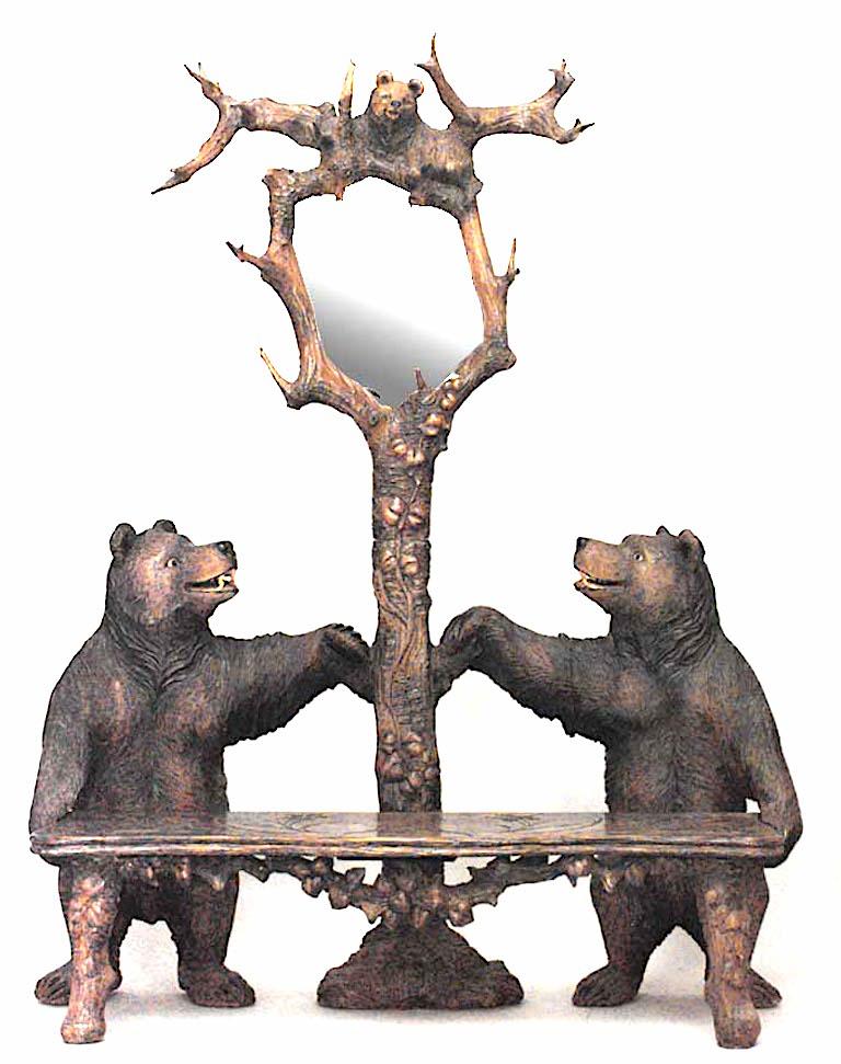 Rustic Black Forest style (20th Cent) carved walnut settee with bear sides suppports and center hat tree
