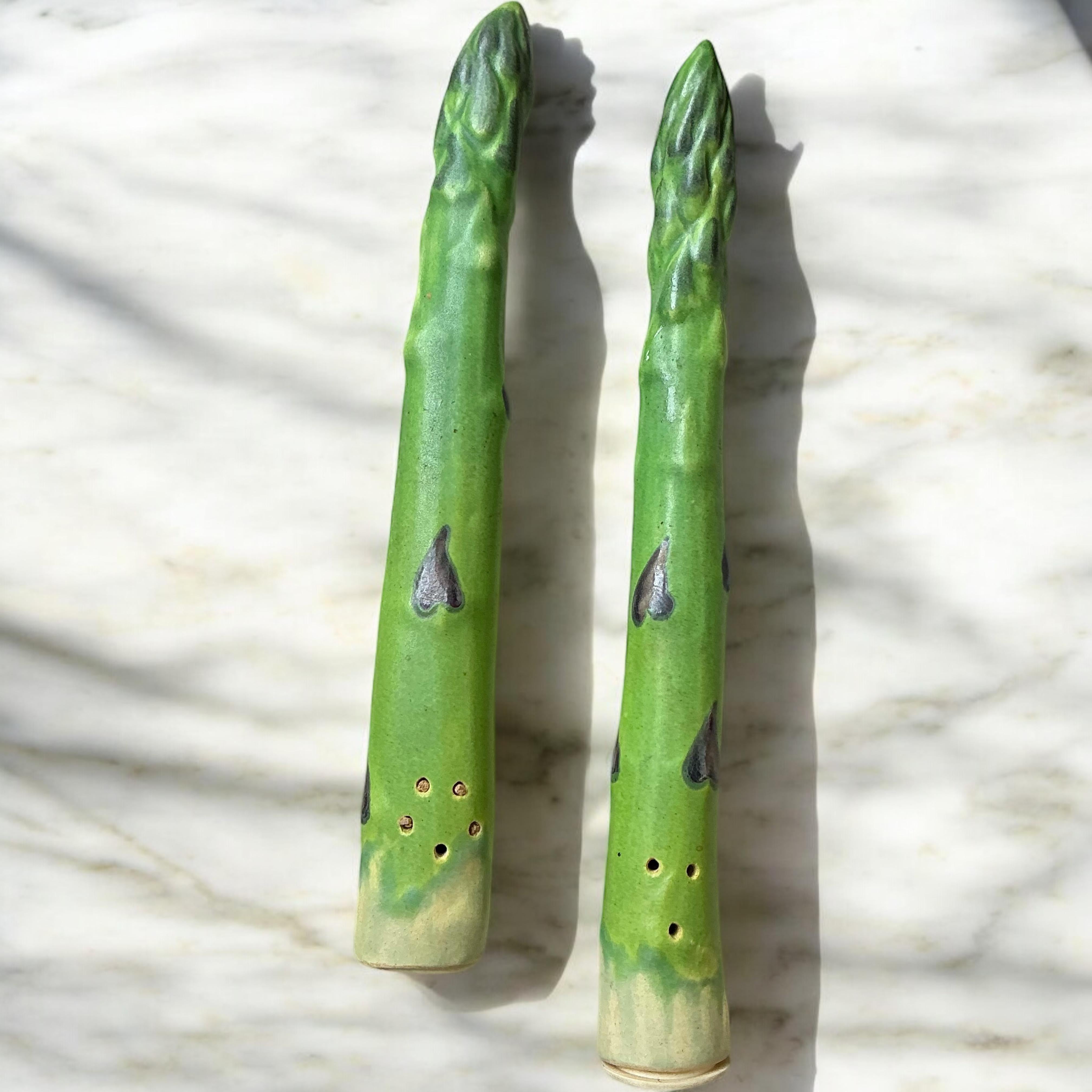 This set of asparagus salt and pepper shakers were hand crafted by California artist, Patricia Garrett. She studied at Berkeley and each piece is lead free. They were manufactured in the 1980s.

Enjoy!
