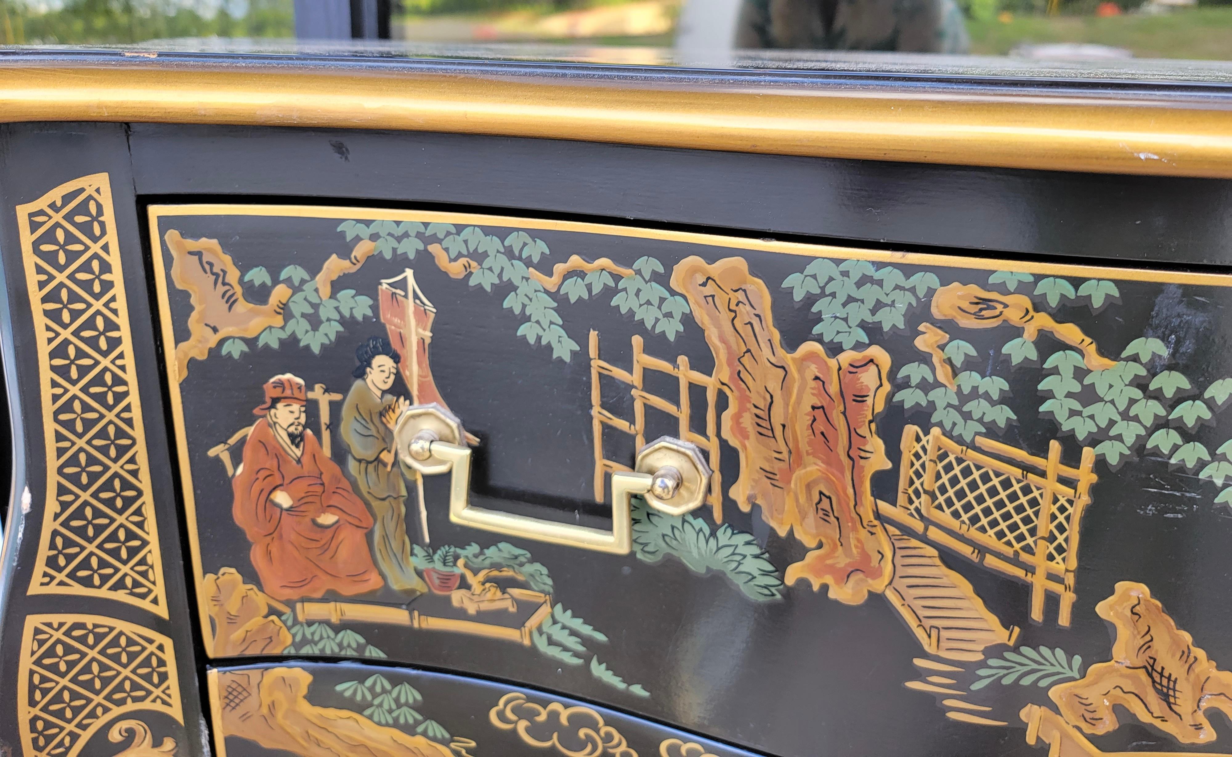 This is a pair of black and gilt chinoiserie chests by Drexel. The brass hardware is original. They have serpentine lines, and are marked in the drawers.

My shipping is for the Continental US only.