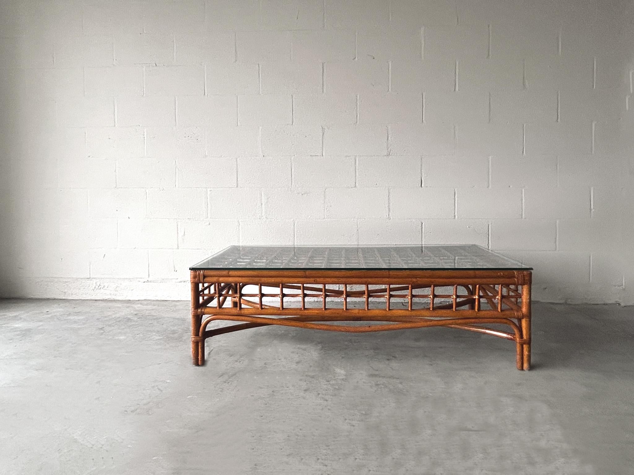 Woven bamboo coffee table. Low profile with glass top. Table's aesthetic mirrors that of Franco Albini. In good vintage condition. Dimensions; Height 16.5