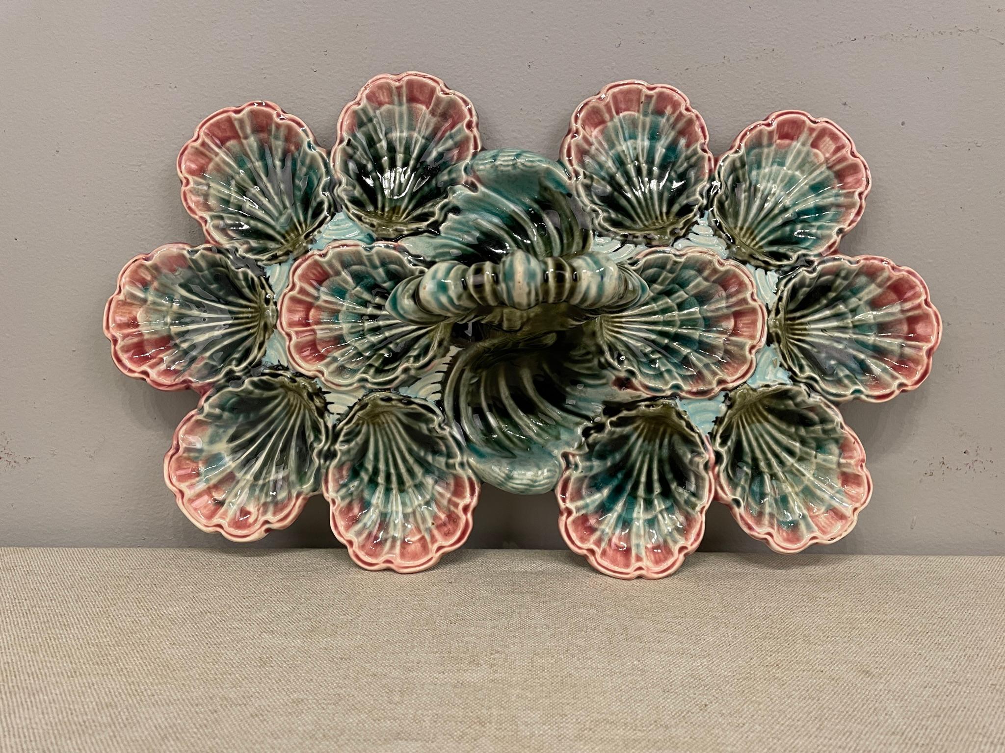 An English Majolica Platter having twelve oyster wells in good condition. No chips no repairs no hairline. Dimensions ate 15