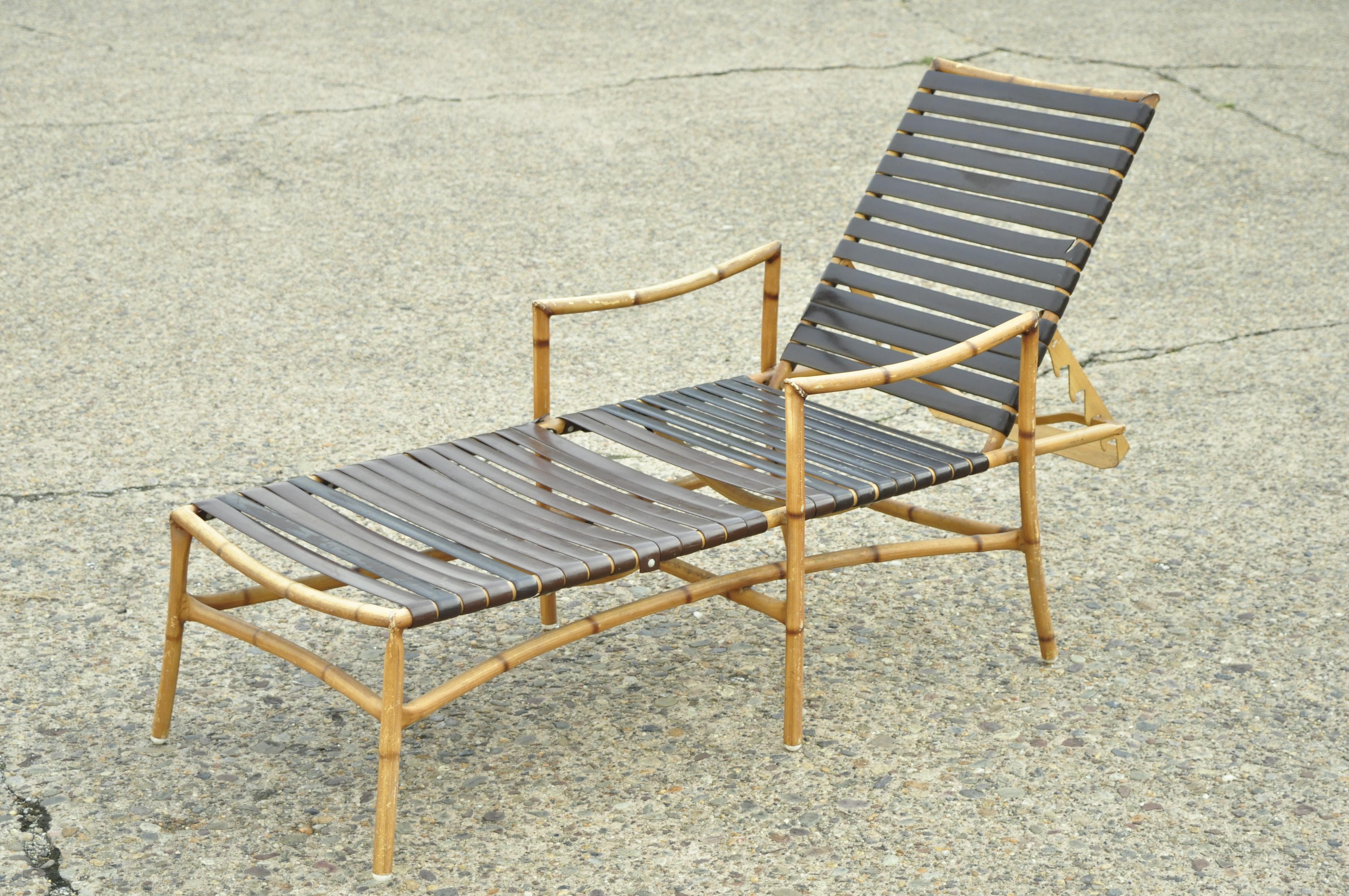 20th century faux bamboo Chinese Chippendale aluminum vinyl strap outdoor patio chaise lounge chairs - a pair. Item features a rubberized vinyl strap, faux bamboo design, adjustable backs, cast aluminum construction, great style and form, circa late