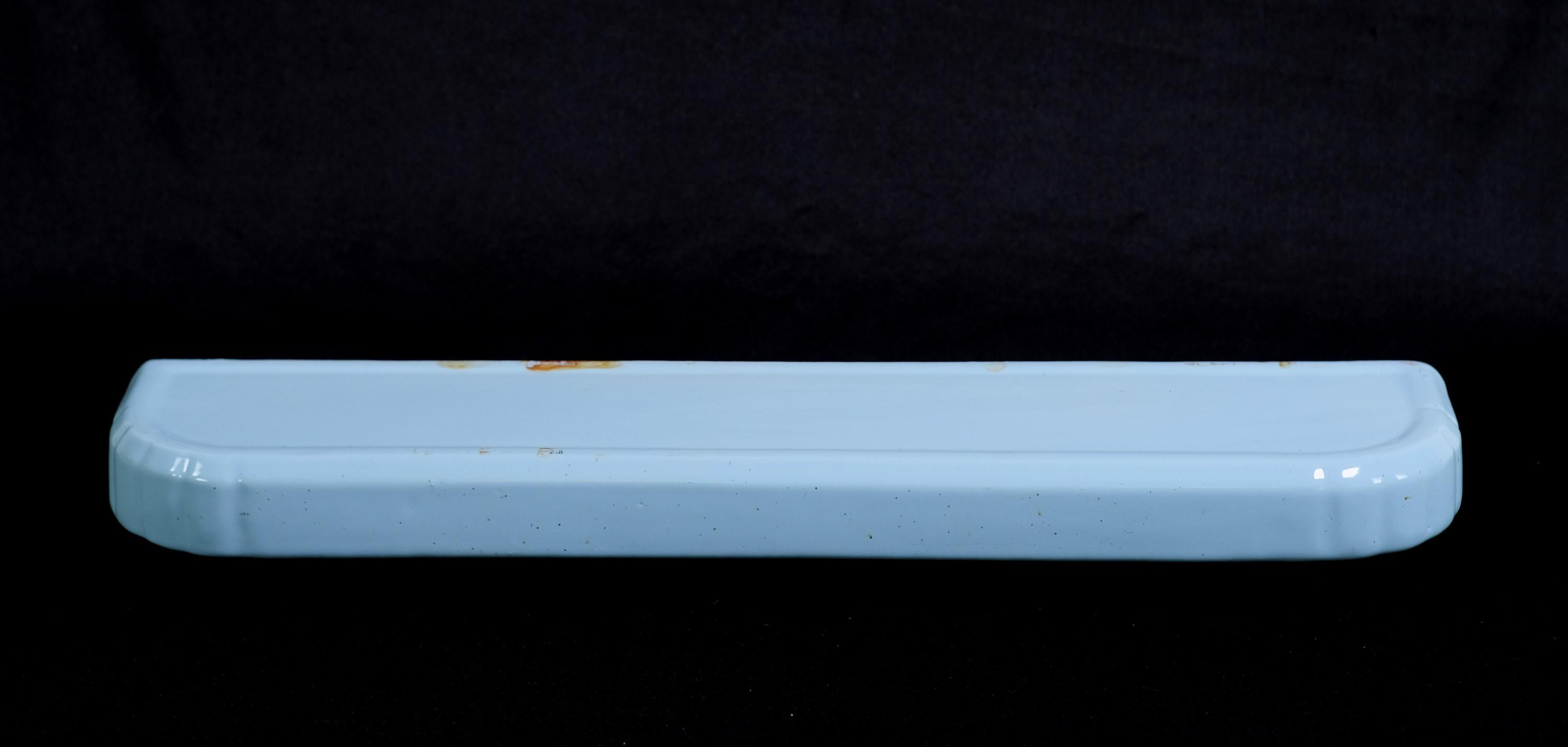 20th century French light blue porcelain wall mount bathroom shelf for towels or whatnot. Mounted with two holes in underneath supports. There are some small black spots showing damage to the glazing. Please see images. Please note, this item is