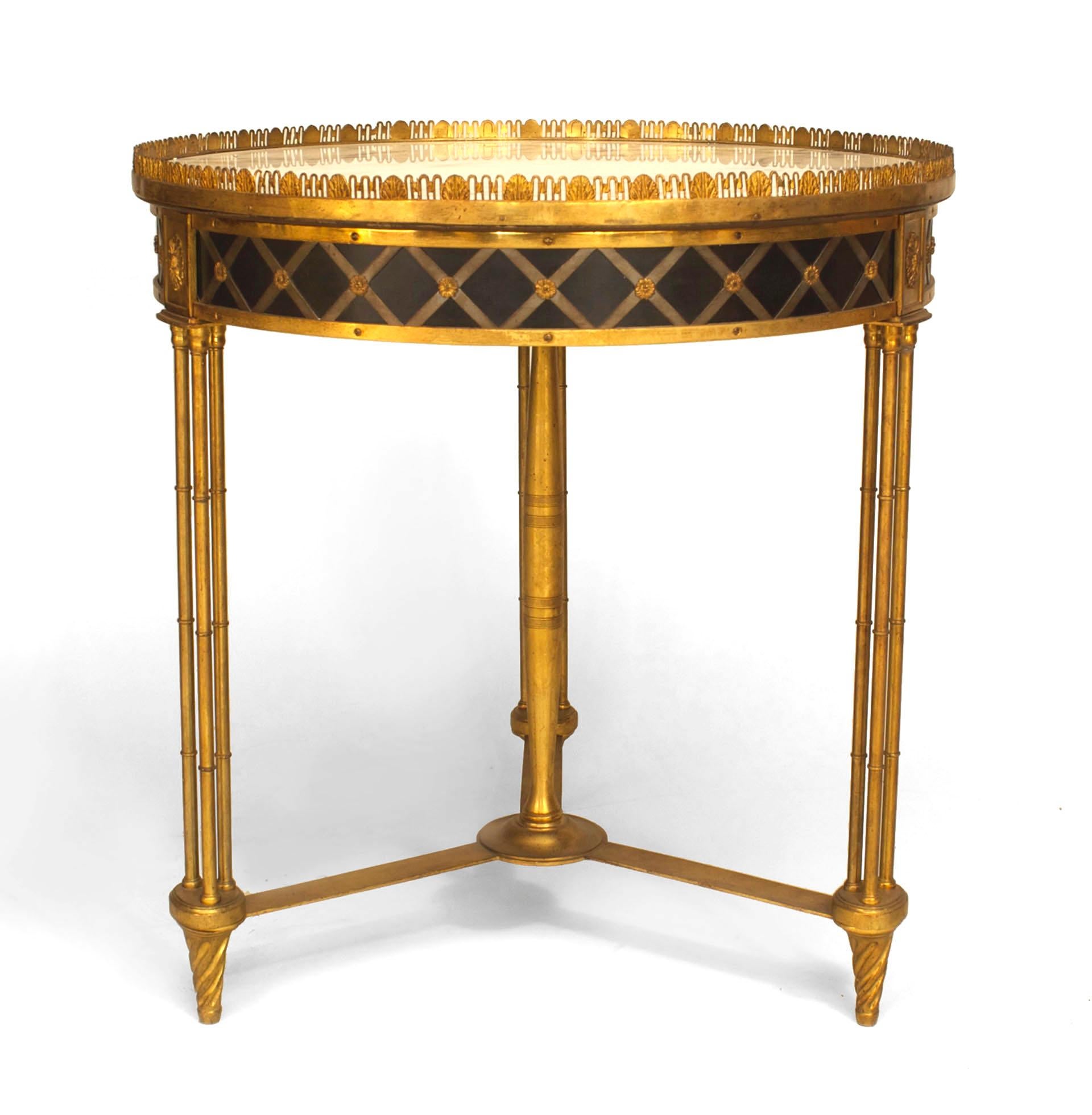 Twentieth century French Charles X style bronze dore gueridon end table with a round white marble top set within a filigree gallery above an x-design apron, three faux bamboo legs, and a finial stretcher.