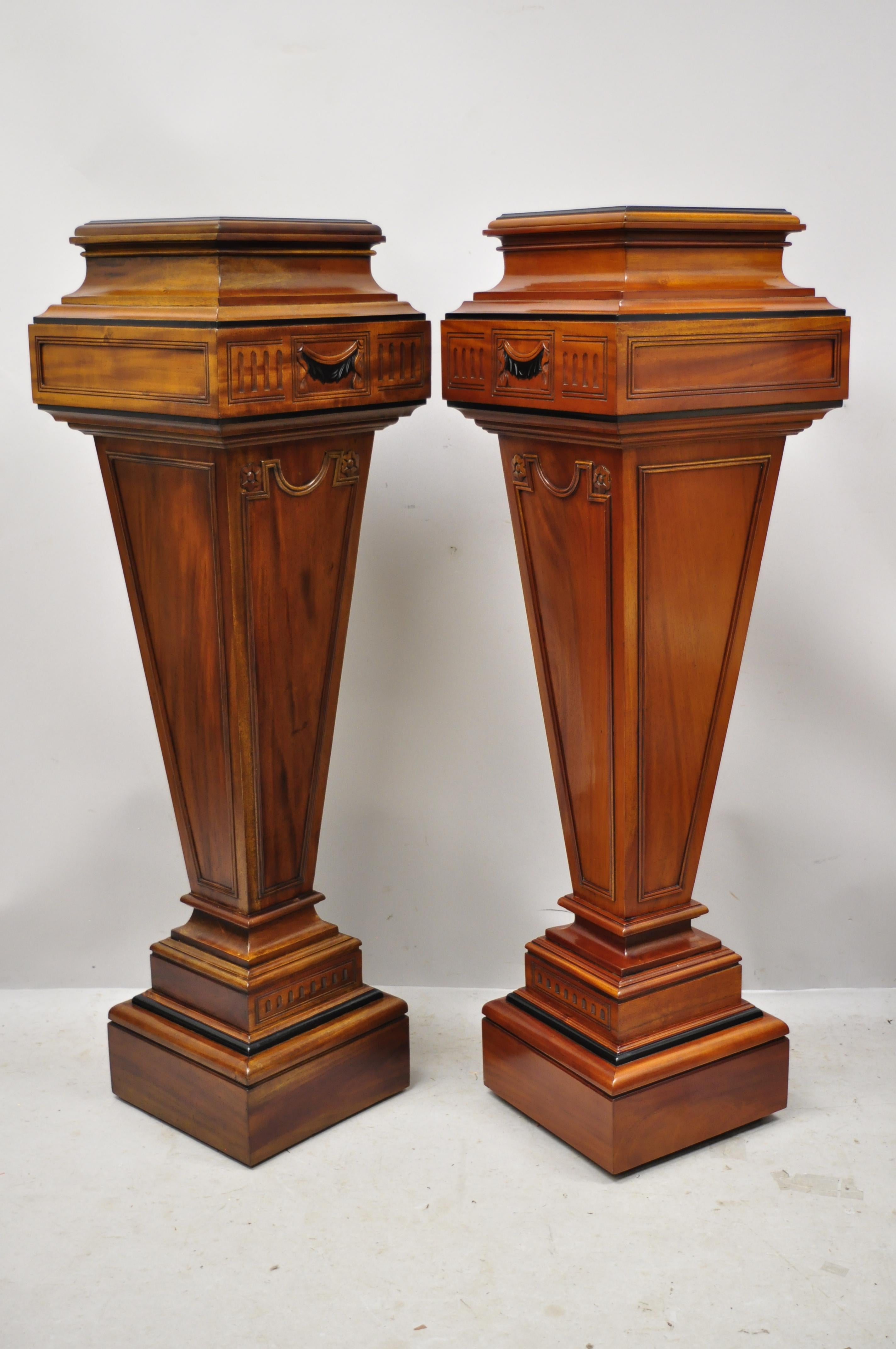 Late 20th century French Empire neoclassical style mahogany wood pedestal plant stands - a pair. Item features solid wood construction, beautiful wood grain, nicely carved details, great style and form, circa Late 20th-Early 21st century.