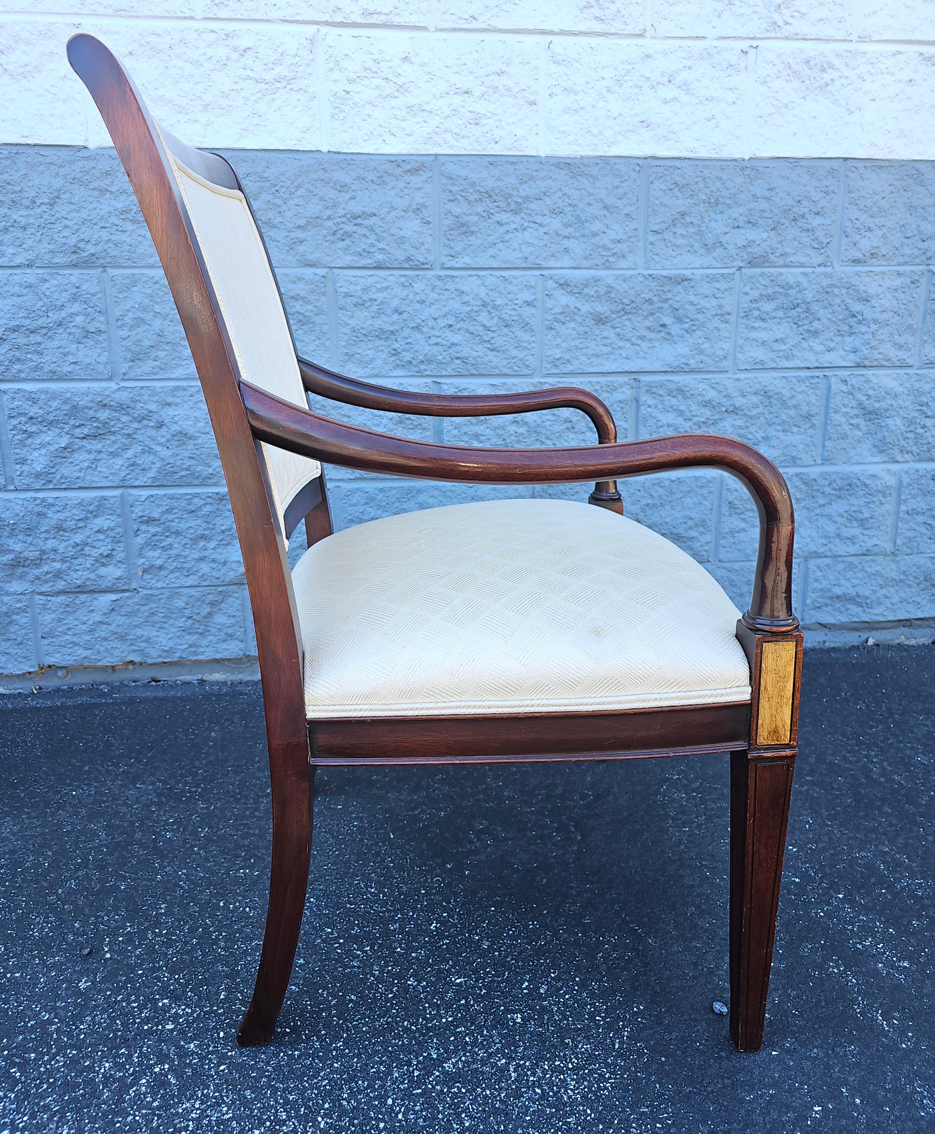A late 20th Century Hickory Chair Sheraton Style Mahogany Inlaid and Upholstered Arm Chair
Measures 25