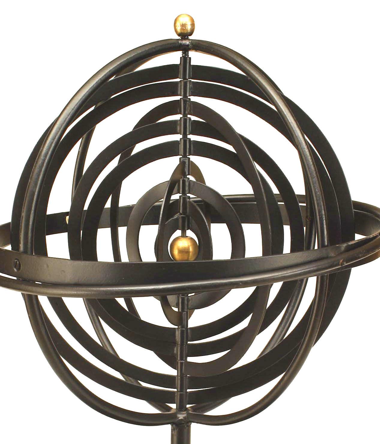 Twentieth century Renaissance style iron armillary sphere inspired by the the Copernican Model with concentric orbits, a tiered stem, and ringed circular base accented by a gold painted sun and finial.