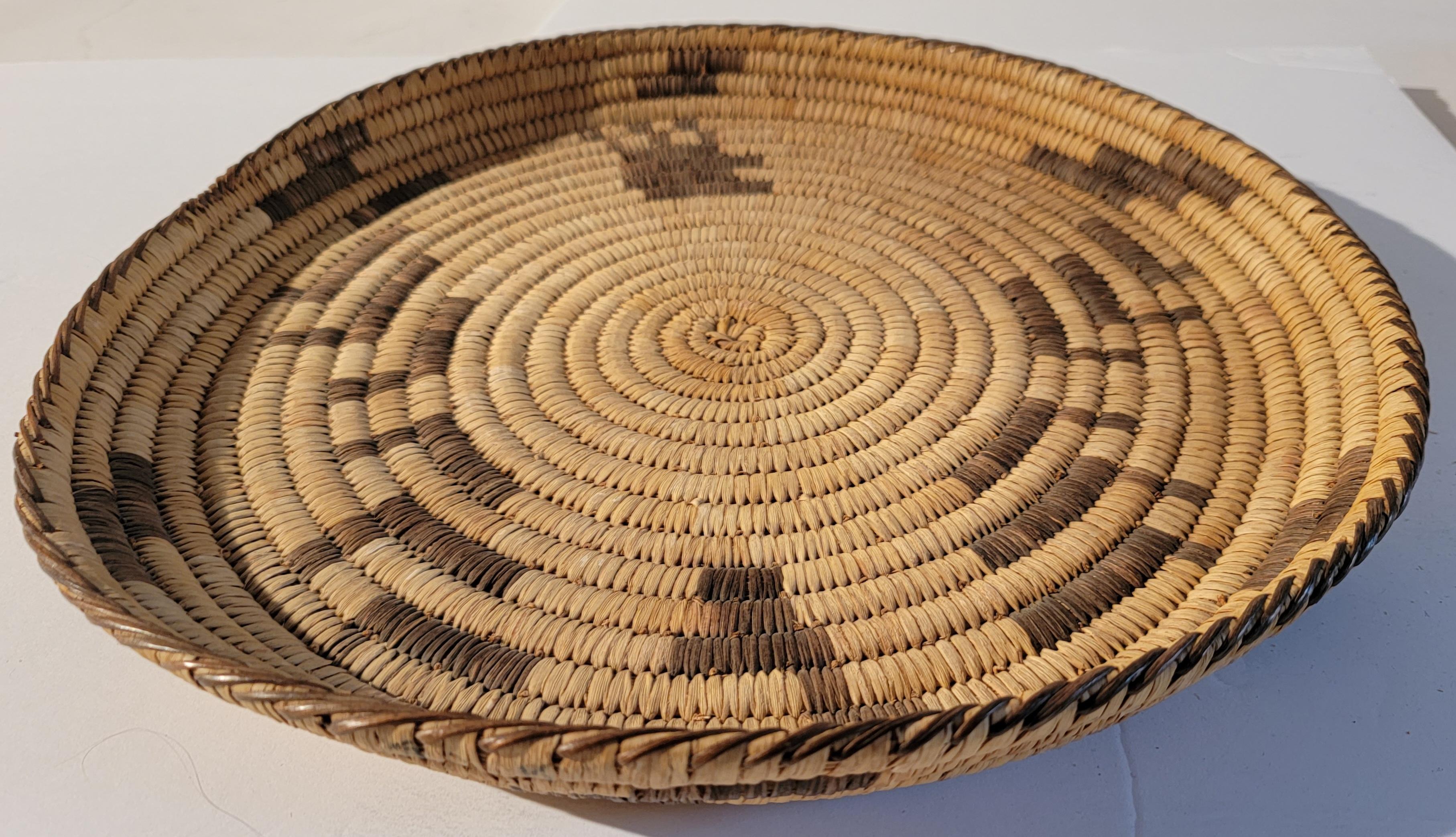 20th C hand woven large Papago Indian tray. Great condition. Great look for Southwestern or cabin decor. Great as as a collection on a shelf or table.