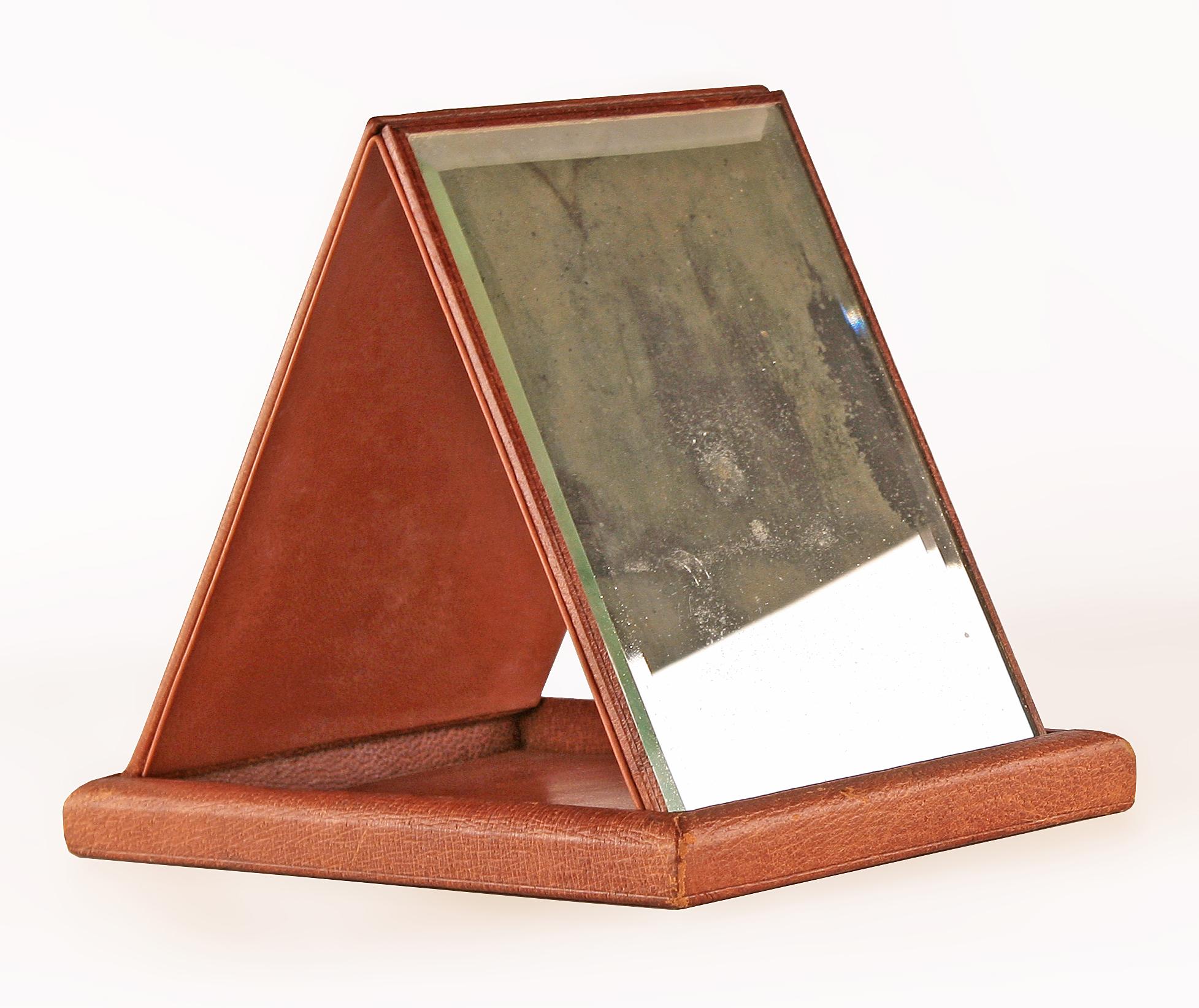 20th century leather and wood foldable beveled mirror by french luxury design house Hermès Paris

By: Hermès Paris
Material: glass, leather, wood, mirror
Technique: embossed, polished, hand-crafted, carved, hand-carved
Dimensions: 8.5 in x 6 in x 1