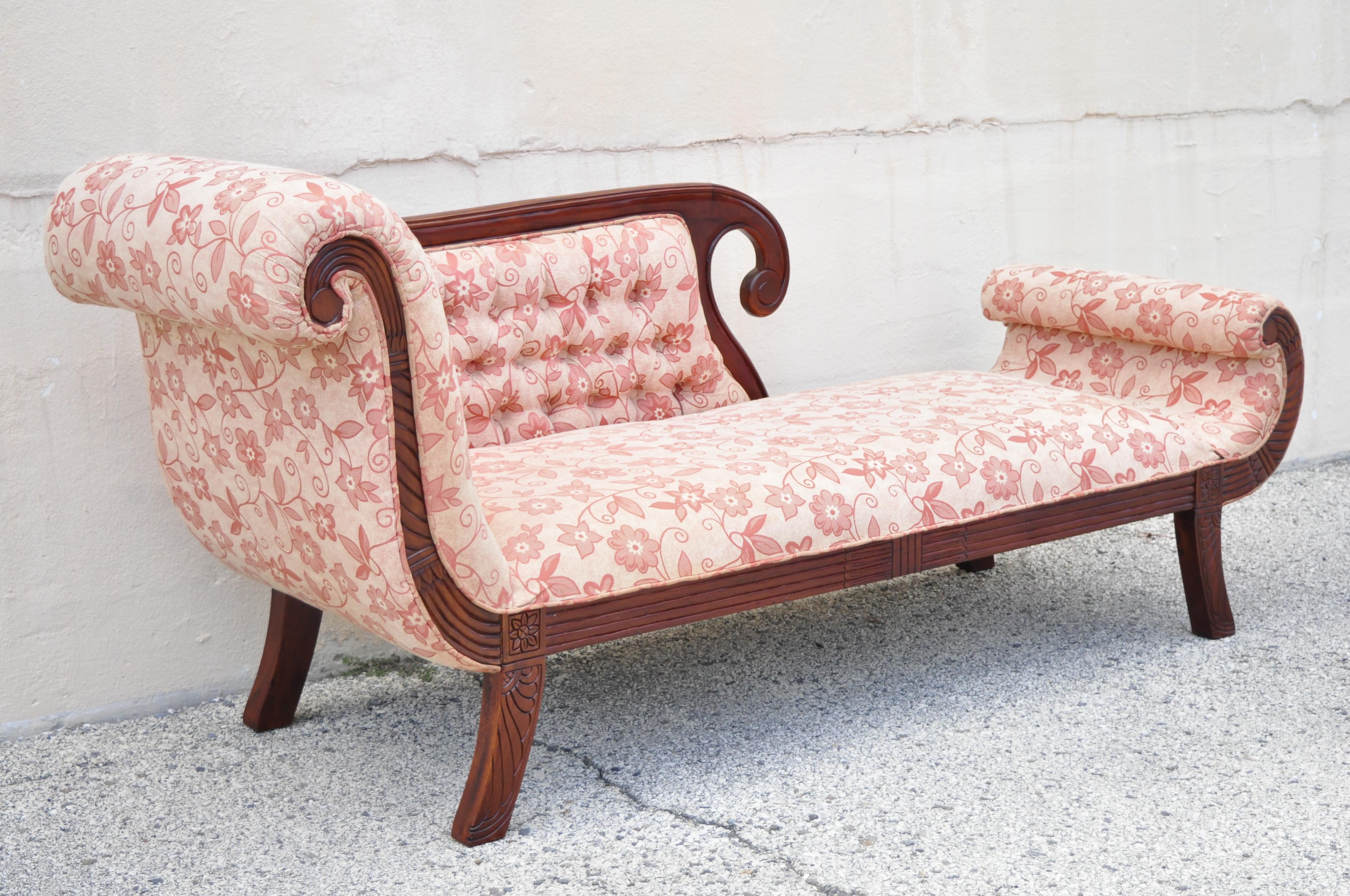 Late 20th century mahogany frame American Empire style fainting couch sofa chaise lounge. Item features pink tufted upholstery, carved scrollwork frame, solid wood frame, beautiful wood grain, nicely carved details, great style and form, circa late