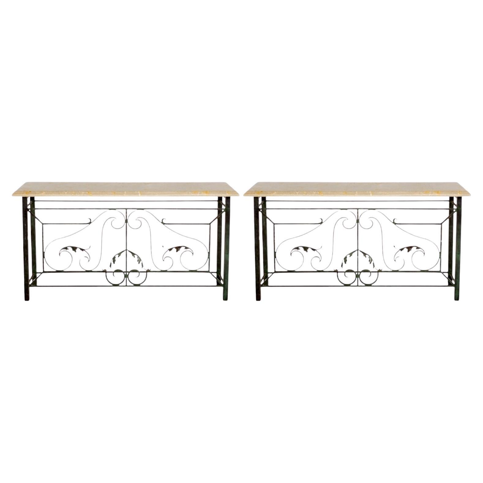 This is a pair of late 20th century cast stone and scrolled patinated metal console tables. These are a very heavy casting and in very good condition. They are unmarked, and the tops are not attached.