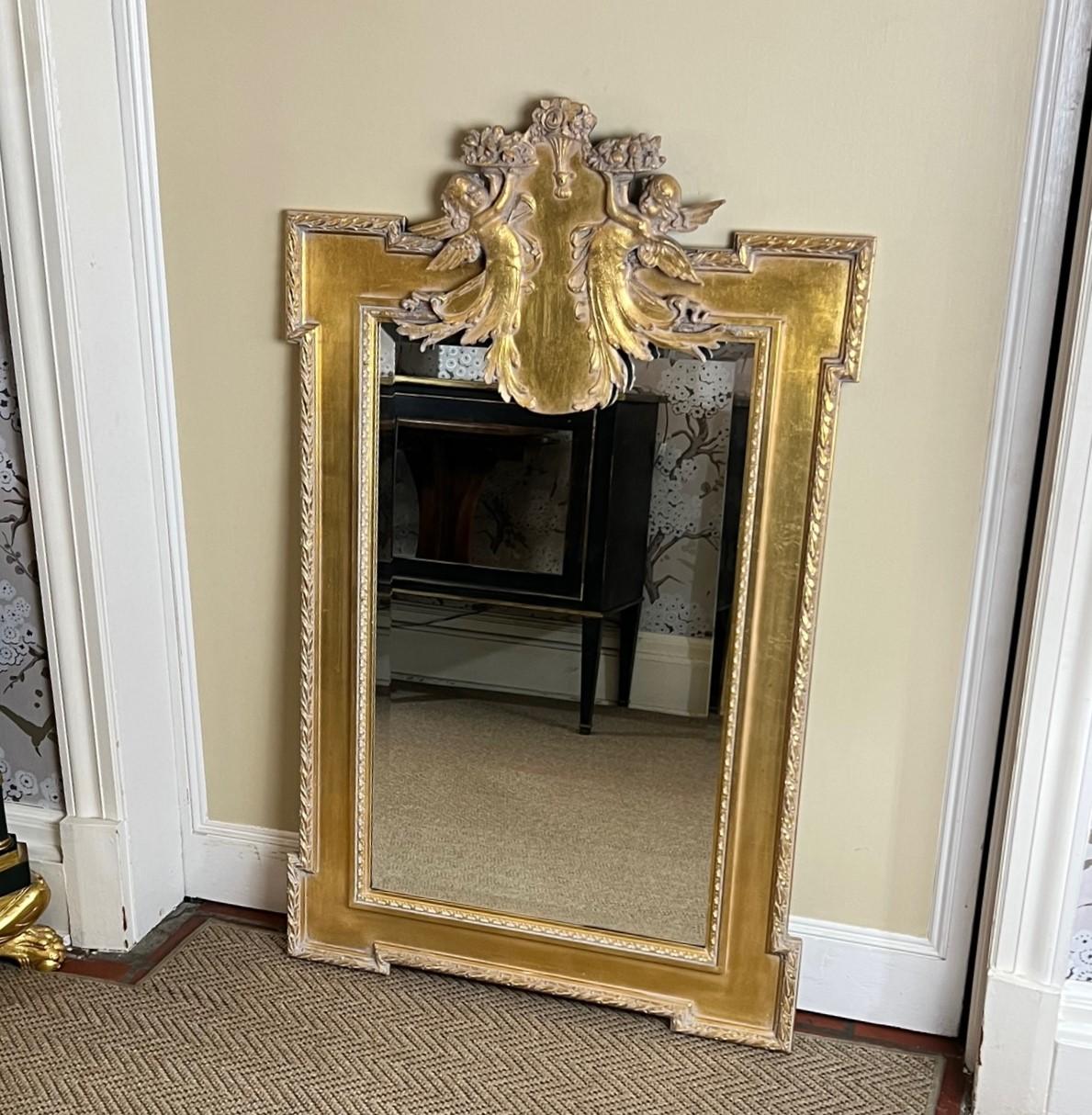 American 20th C. Neoclassical Style Giltwood Mirror with Cherub and Floral Decoration For Sale