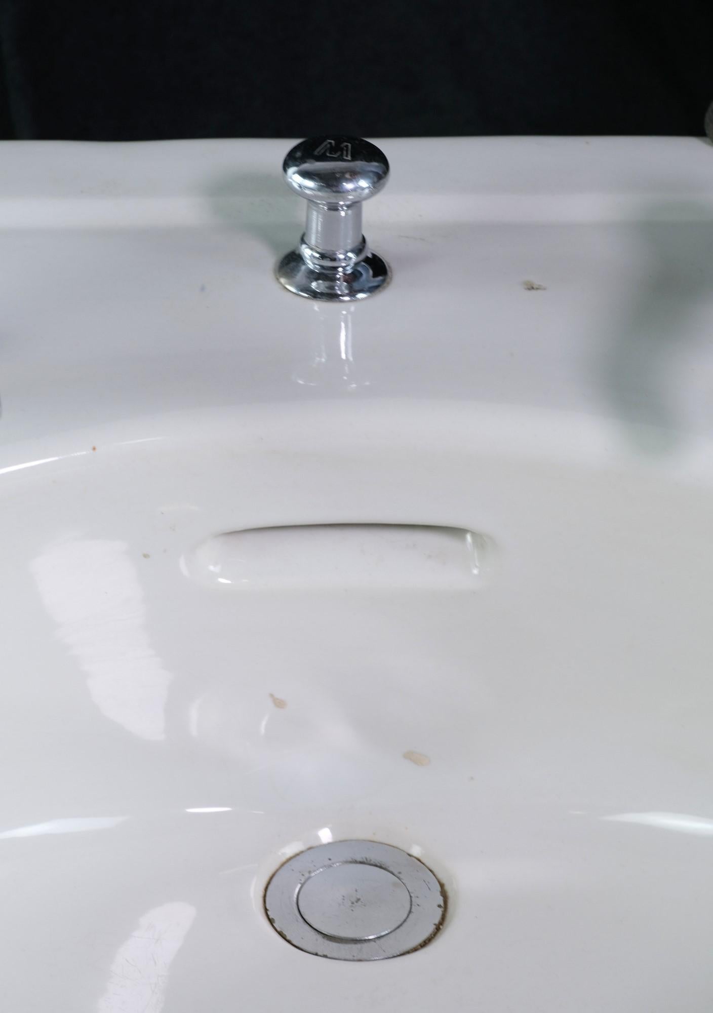 20th C. Oval Basin White Porcelain Wall Sink w/ Curved Front  In Good Condition In New York, NY