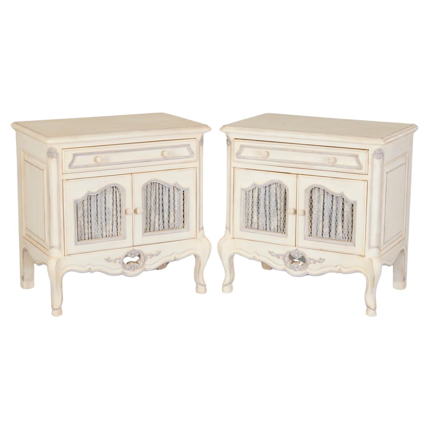 20th c. Pair of Louis XV Style Painted Nightstands with Fabric Door Lining For Sale